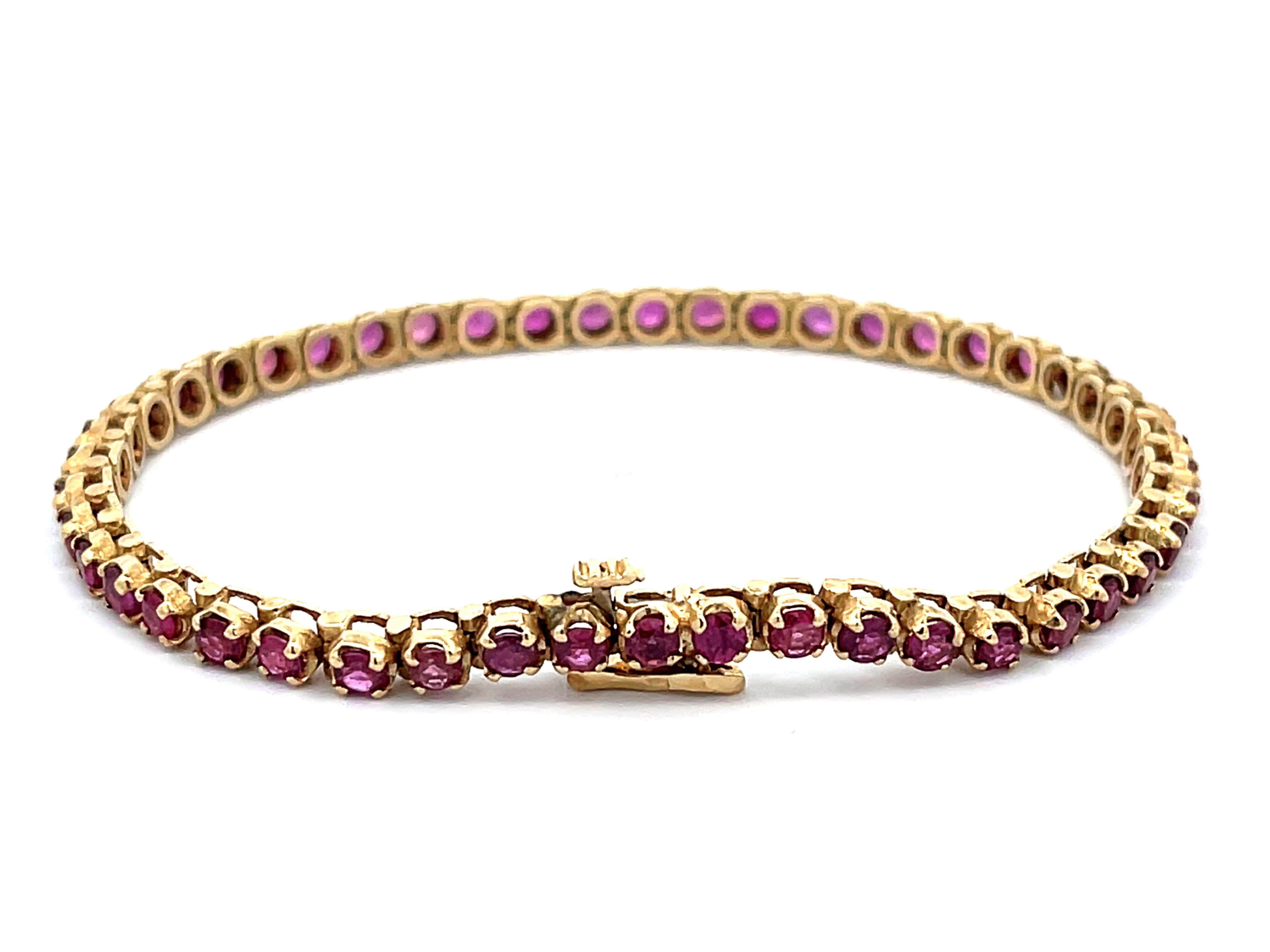 Modern Round Red Ruby Tennis Bracelet in 14k Yellow Gold For Sale