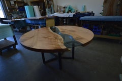 Round RiverRun, Live Edge Dining Table in Character Grade Maple with Blue Glass
