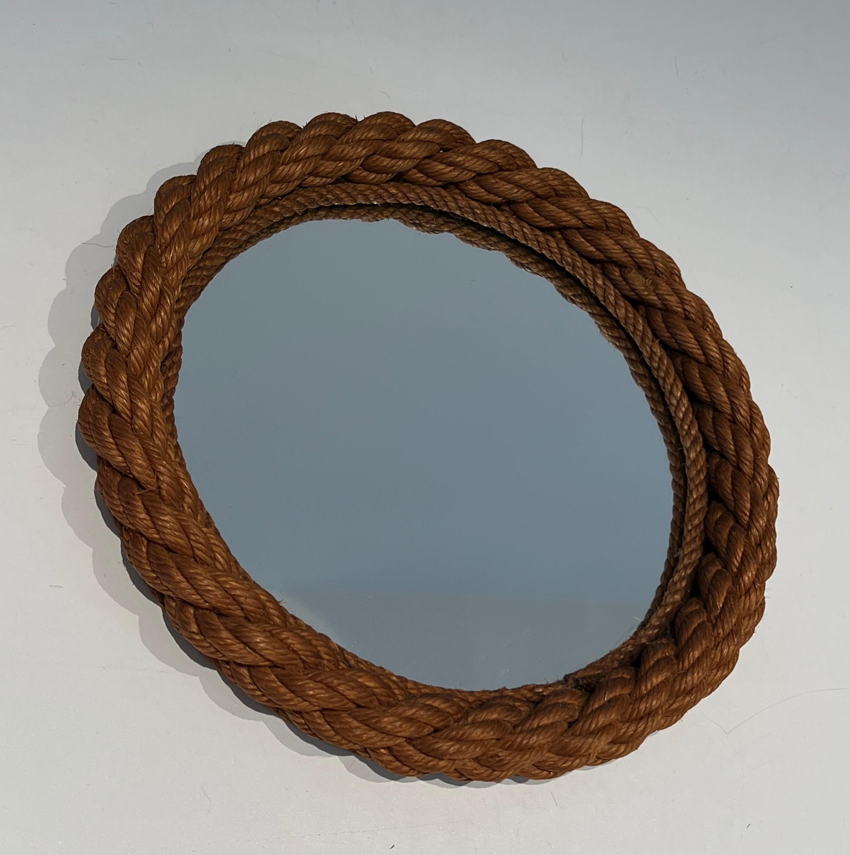 This nice round mirror is made of rope. This is a French work in the Style of Adrien Audoux and Frida Minet (Audoux-Minet). Circa 1970