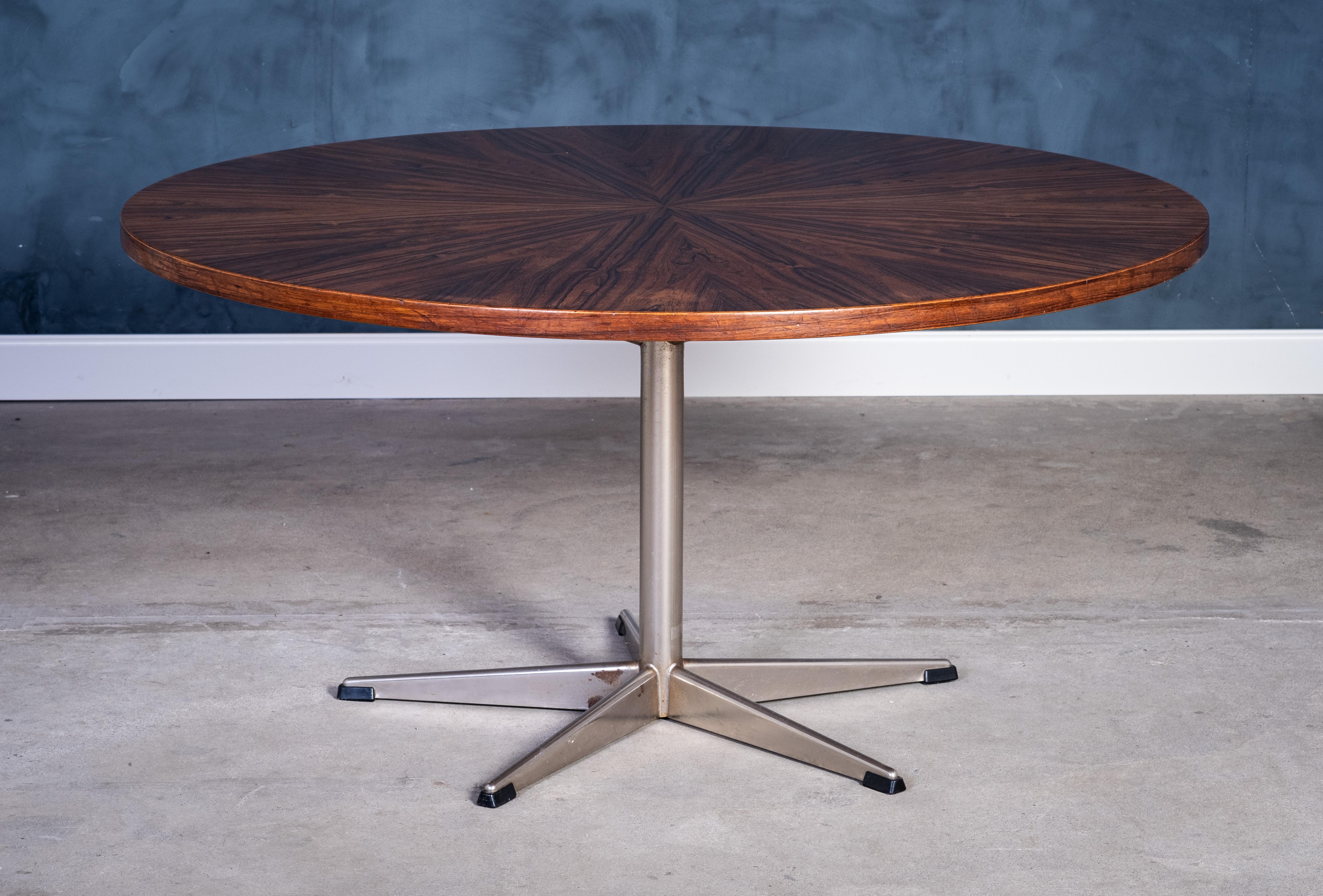 Elegant round coffee table crafted in richly grained rosewood, mounted on a five-leg steel base. Produced in Denmark in the 1960s. The minimalist design and clean proportions are strongly in line with the mid-century aesthetic.

The table is in good