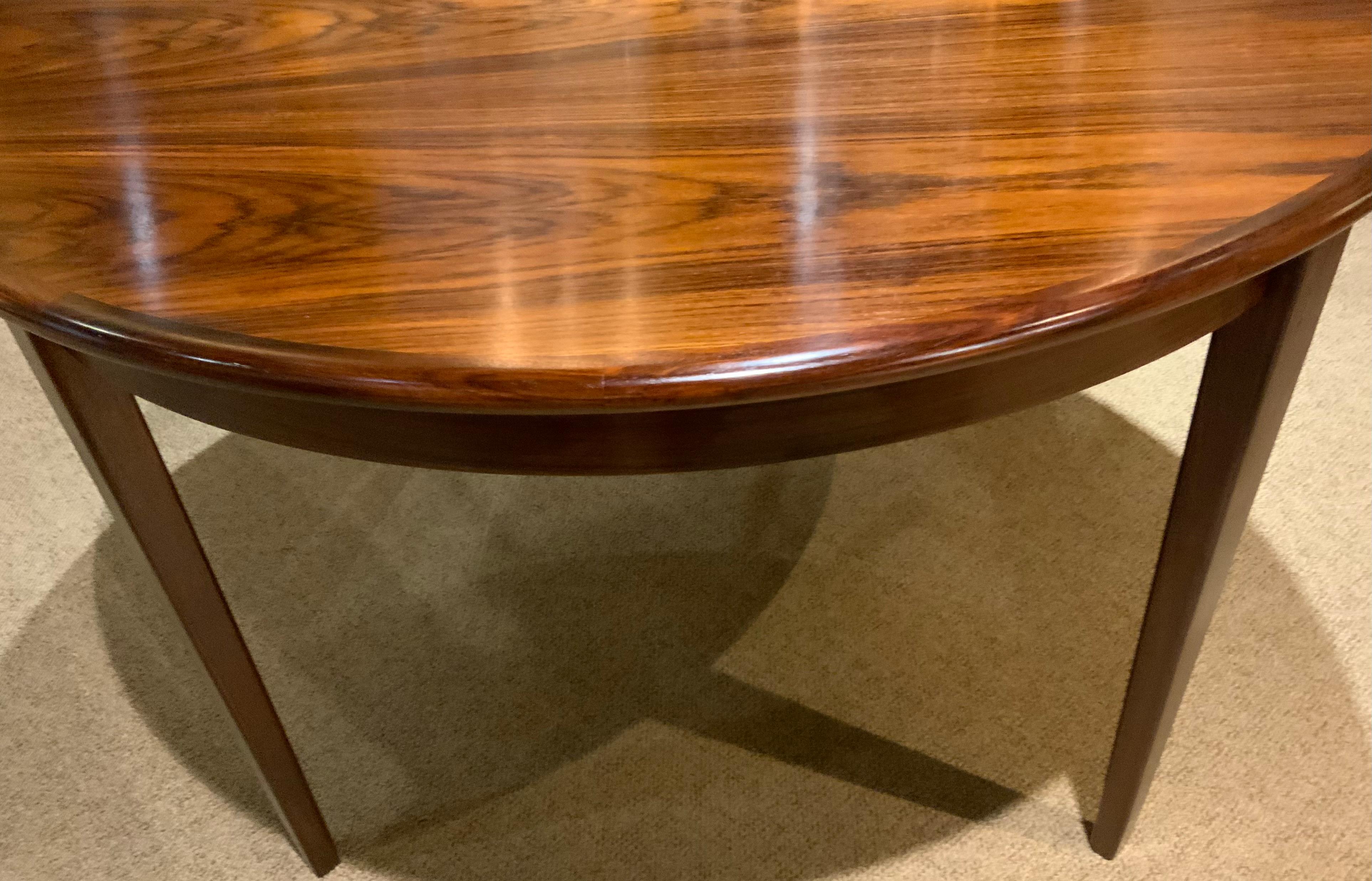 Rosewood Round  rosewood dining table by sigh and sons, mid 20 th c.  For Sale