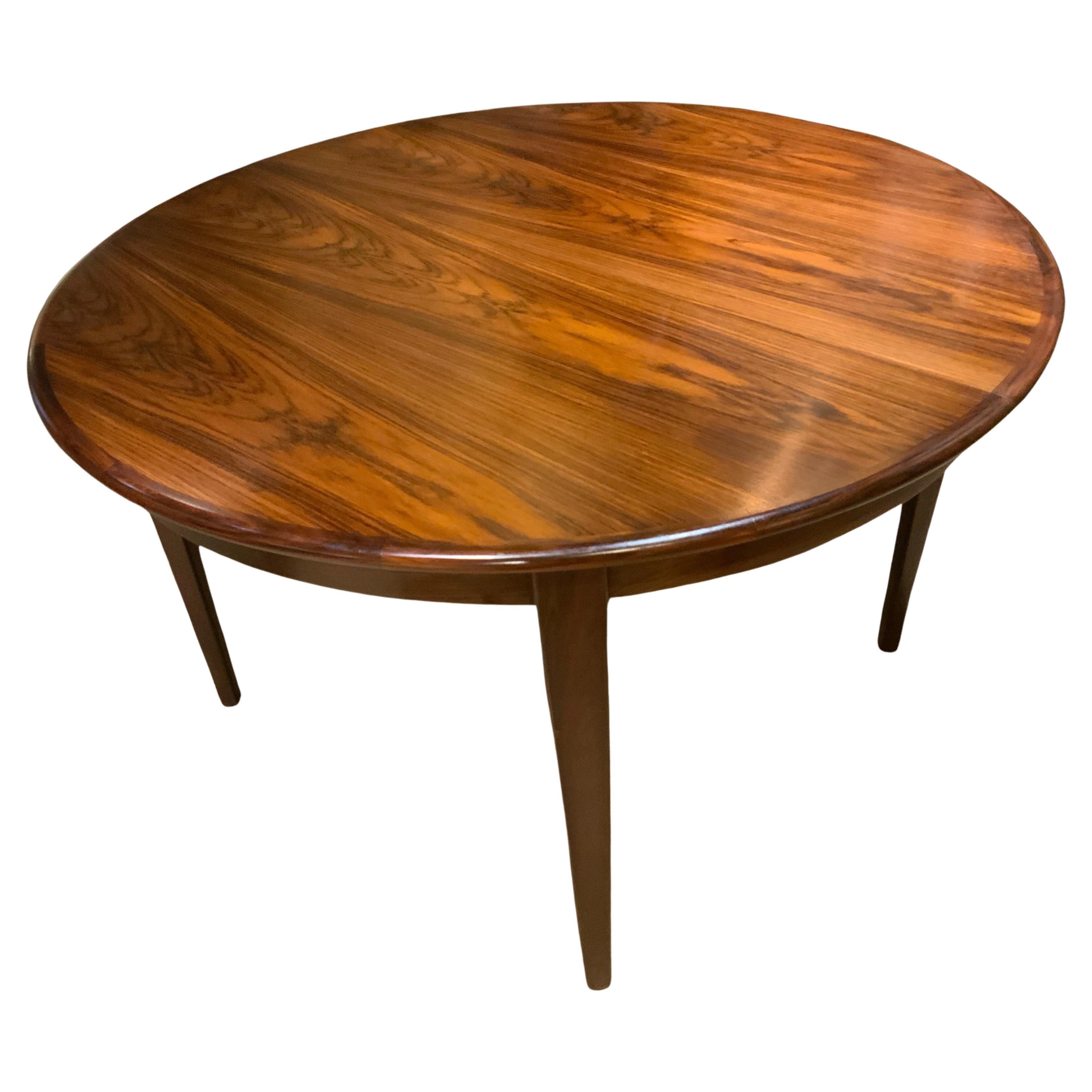 Round  rosewood dining table by sigh and sons, mid 20 th c.  For Sale