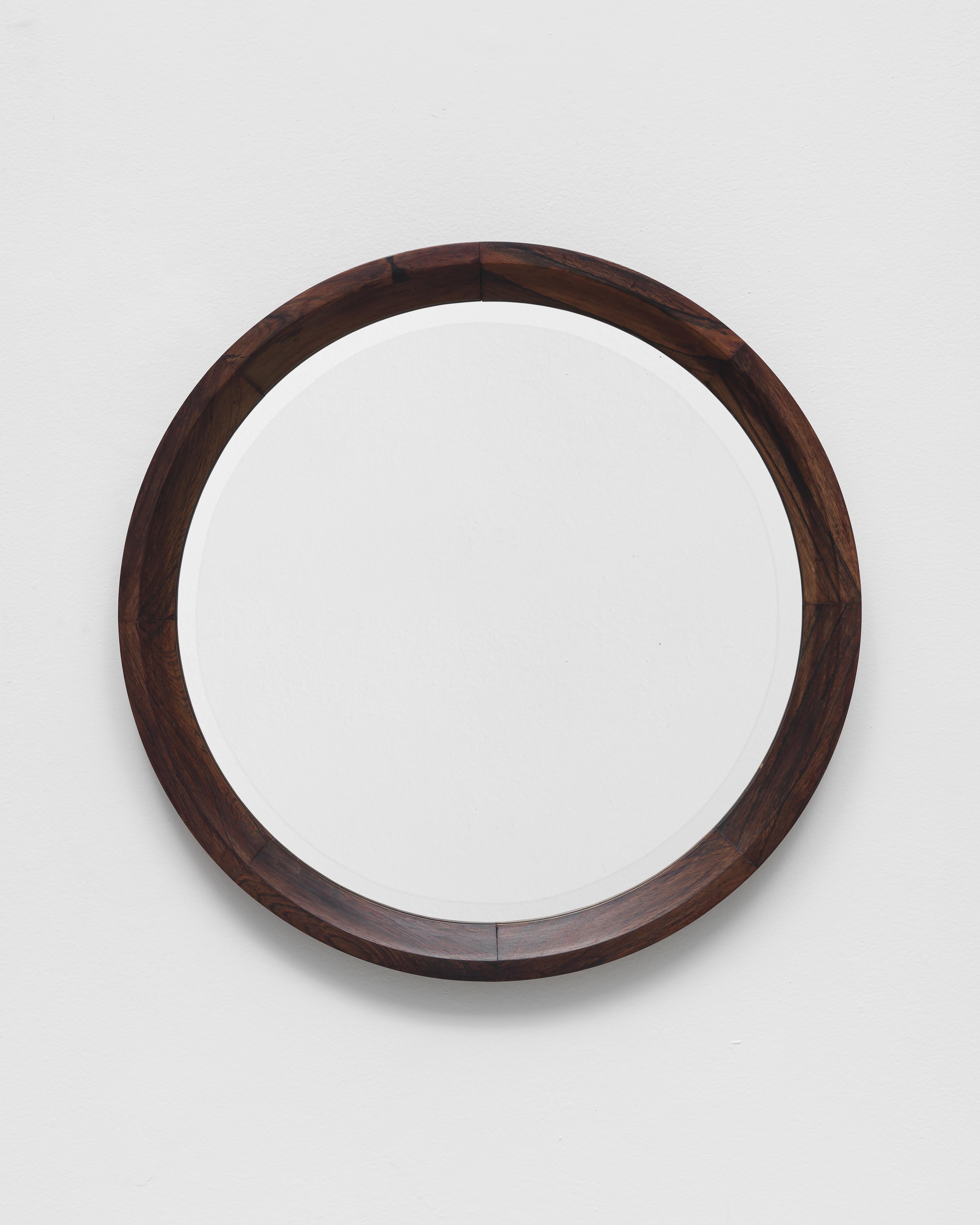 Round mirror with rosewood frame, probably designed by Sergio Rodrigues in the 1960s. 