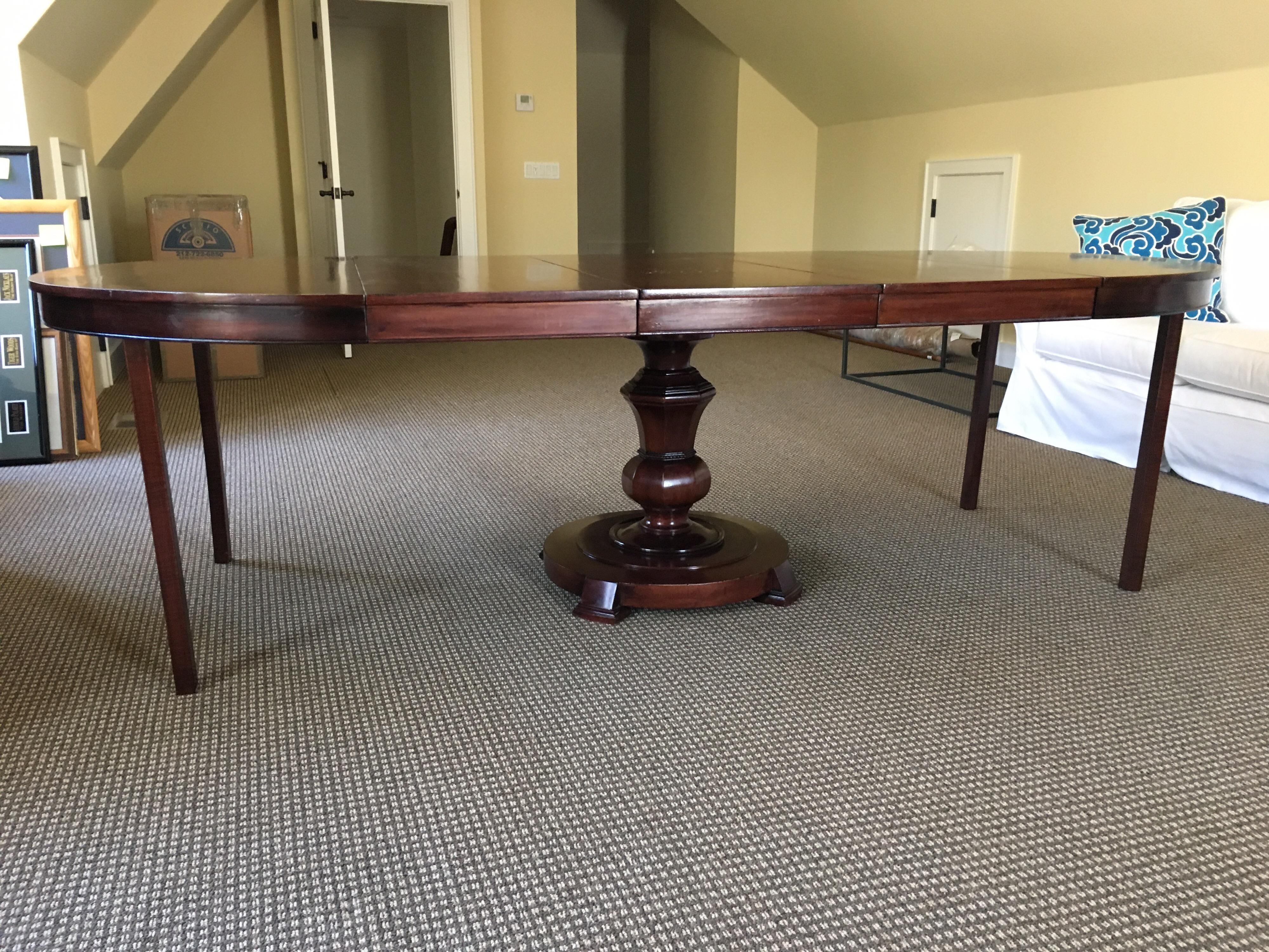Regency style round rosewood center or dining table, 1950s by Maitland Ward, ebony banding.
48