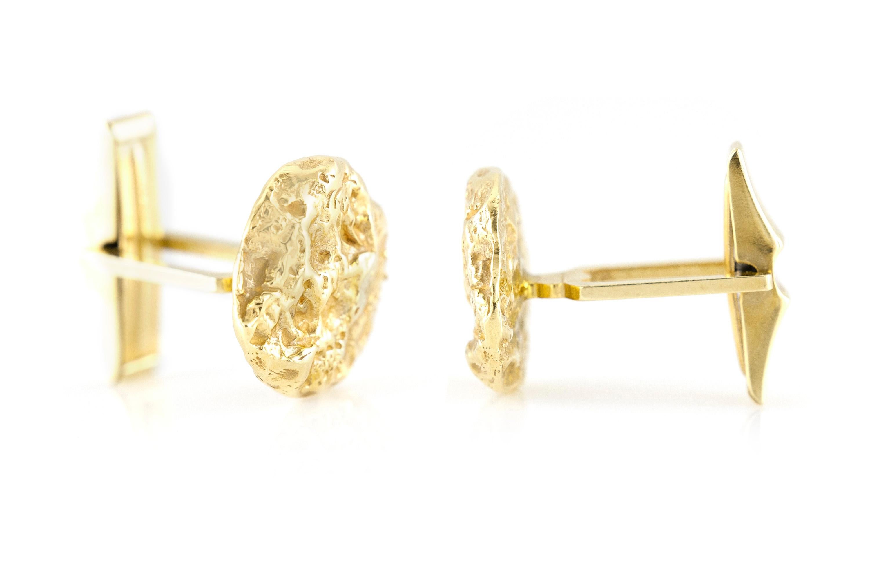 Cufflinks finely crafted in 14k yellow gold weighing a total of 8.5 dwt., size of each cufflink is 0.75 inch. Circa 1920.