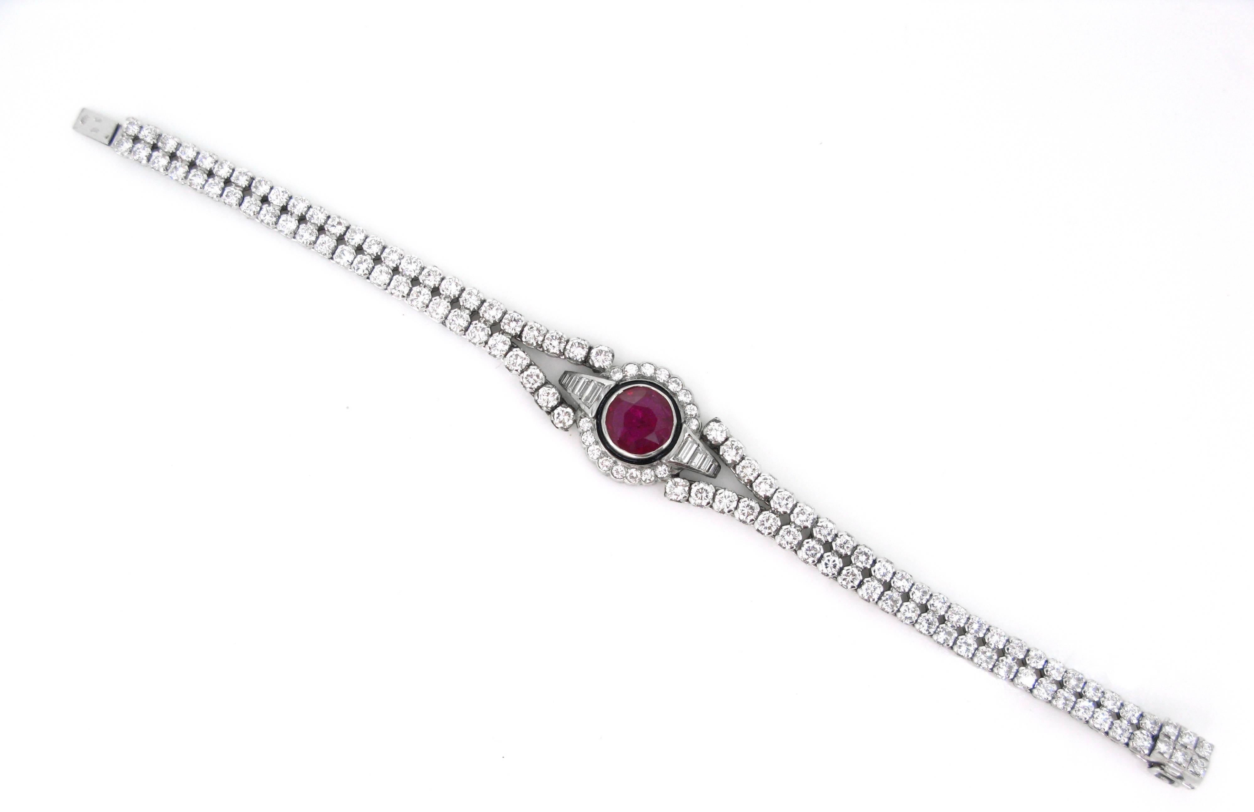 Weight: 23.80gr

Metal: 18kt white Gold and enamel

Stones: 1 Ruby
• Cut: Round
• Carat Weight: 2ct approximately

Others: 124 Diamonds
• Cut: 116 Brilliant cut – 8 tappers
• Total carat weight: 8ct approximately
• Colour: G/H
• Clarity: