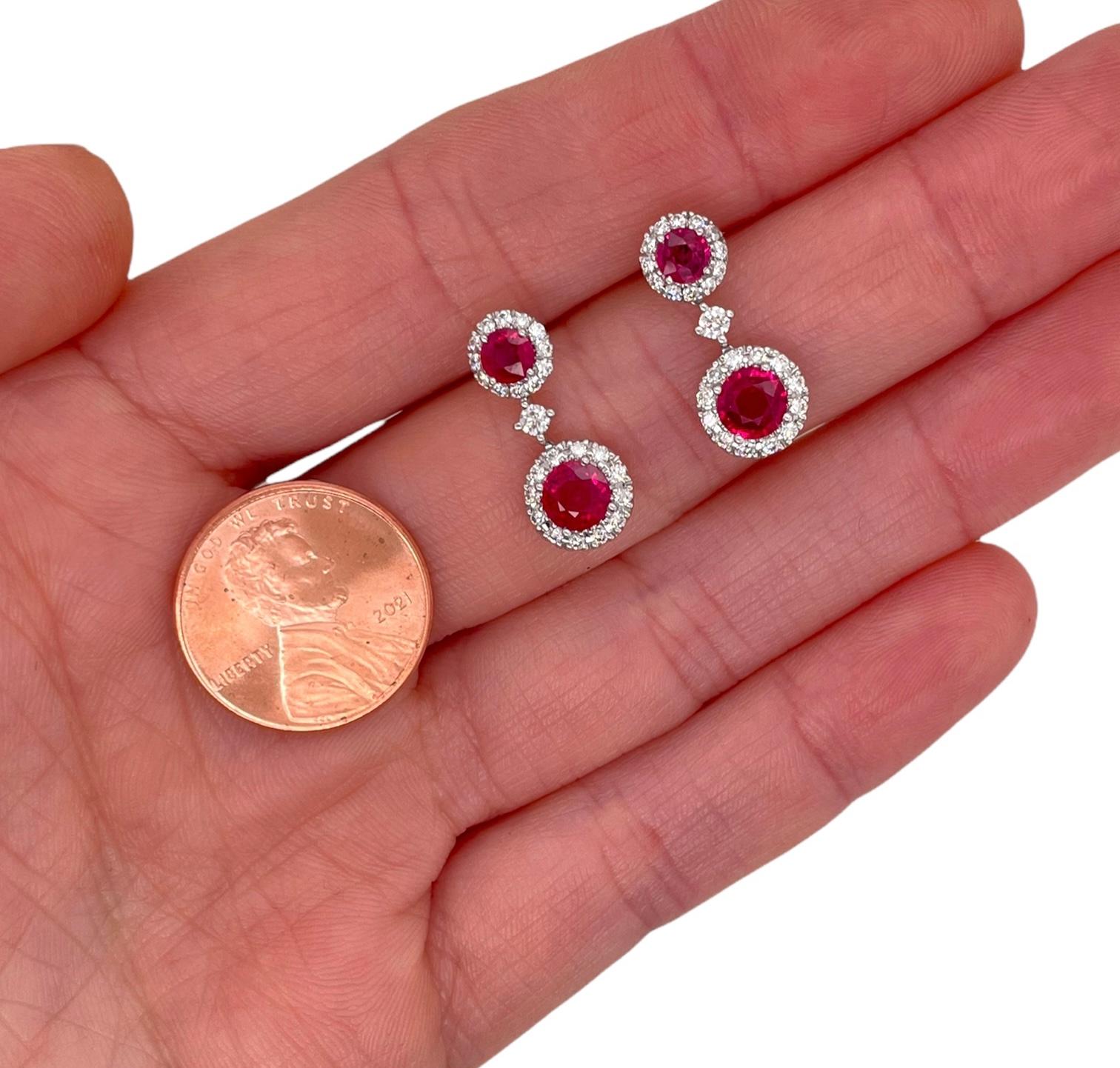 Earrings contain 4 round brilliant rubies, 1.68tcw and round brilliant diamonds, 0.53tcw. Diamonds are near colorless and SI1 in clarity, excellent cut. Stones are mounted within handmade prong settings. Earrings measure 18mm long and have a push