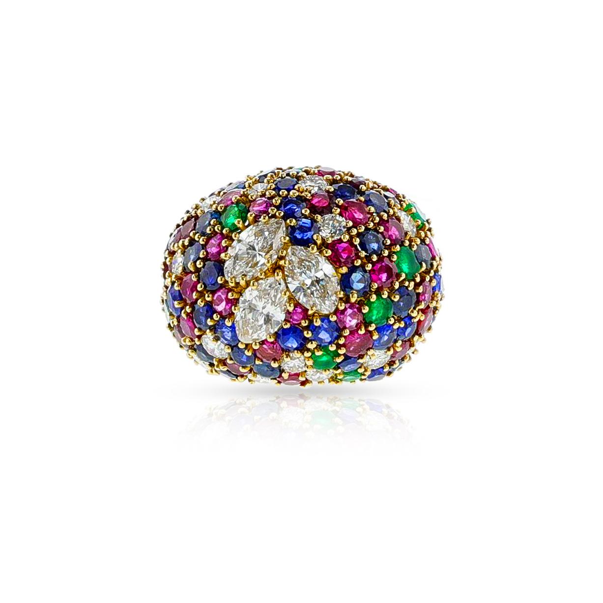 Crafted in elegant 18 karat yellow gold, this luxurious Bombe Ring is adorned with glimmering round-shape ruby, emerald, sapphire and marquise diamonds, weighing in at approximately 3 carats. Possessing a weight of 20.59 grams, this splendid ring is