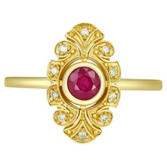 Round ruby ring in 14k gold. 