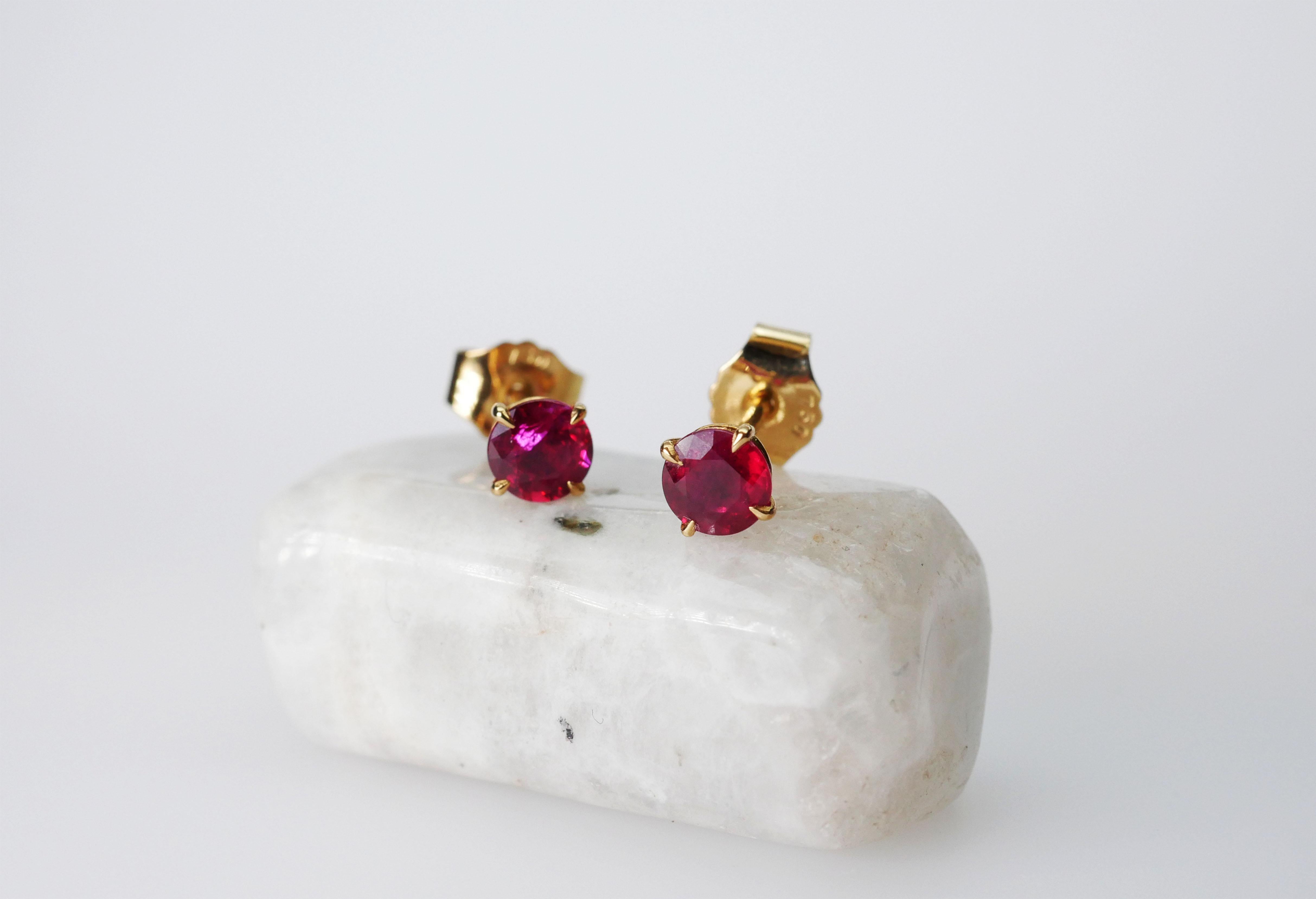 Handmade solitaire bright red round ruby stud earrings in 18k yellow gold. Simple and elegant with talon-shaped claws and an open basket setting, perfect to wear solo or stacked.

Total Ruby Weight 2/1.20 Carats