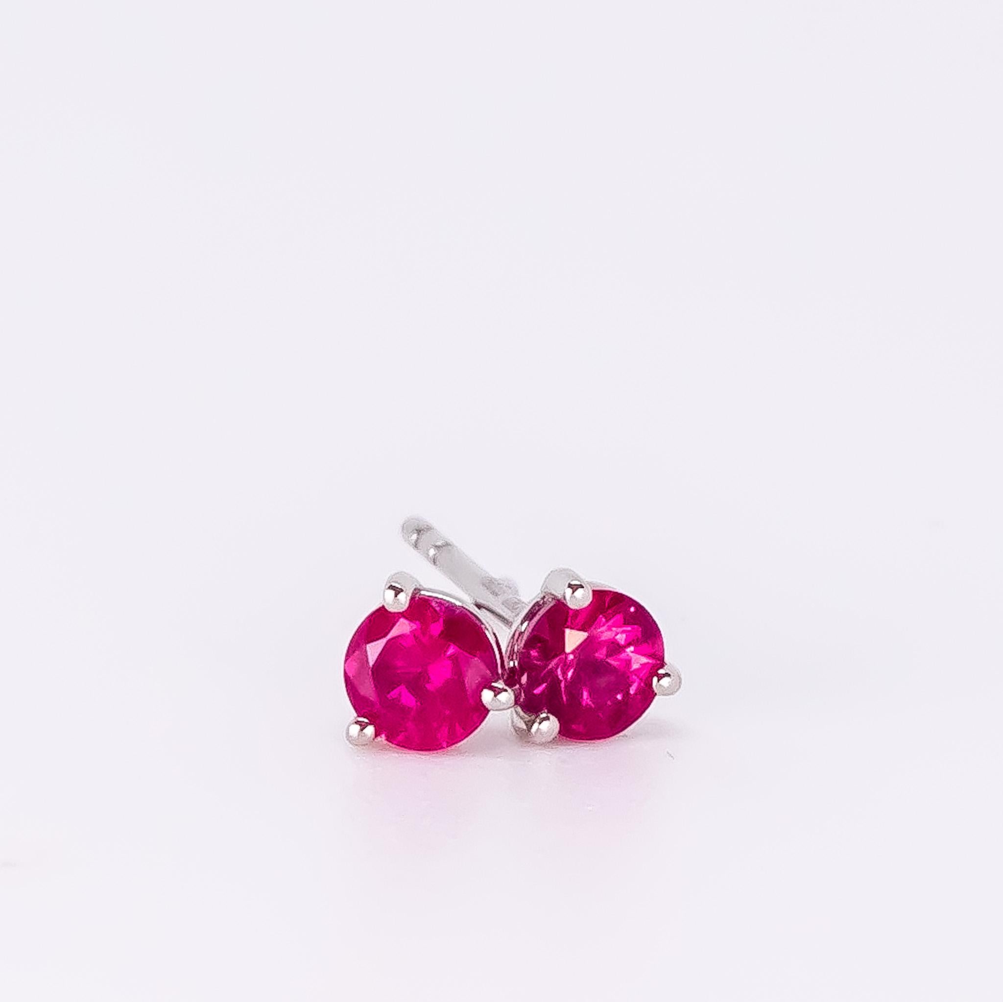 Beautiful round ruby studs set in Platinum. 

These Mozambique rubies are a stunning pinkish-red colour. The studs are set in a three prong martini setting with a butterfly push back. 

The rubies are full of live, cut in a round brilliant shape,