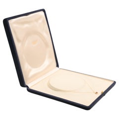 Collana con rubino rotondo e diamanti a raggiera (circa 0,50 carati) in oro giallo 14 carati