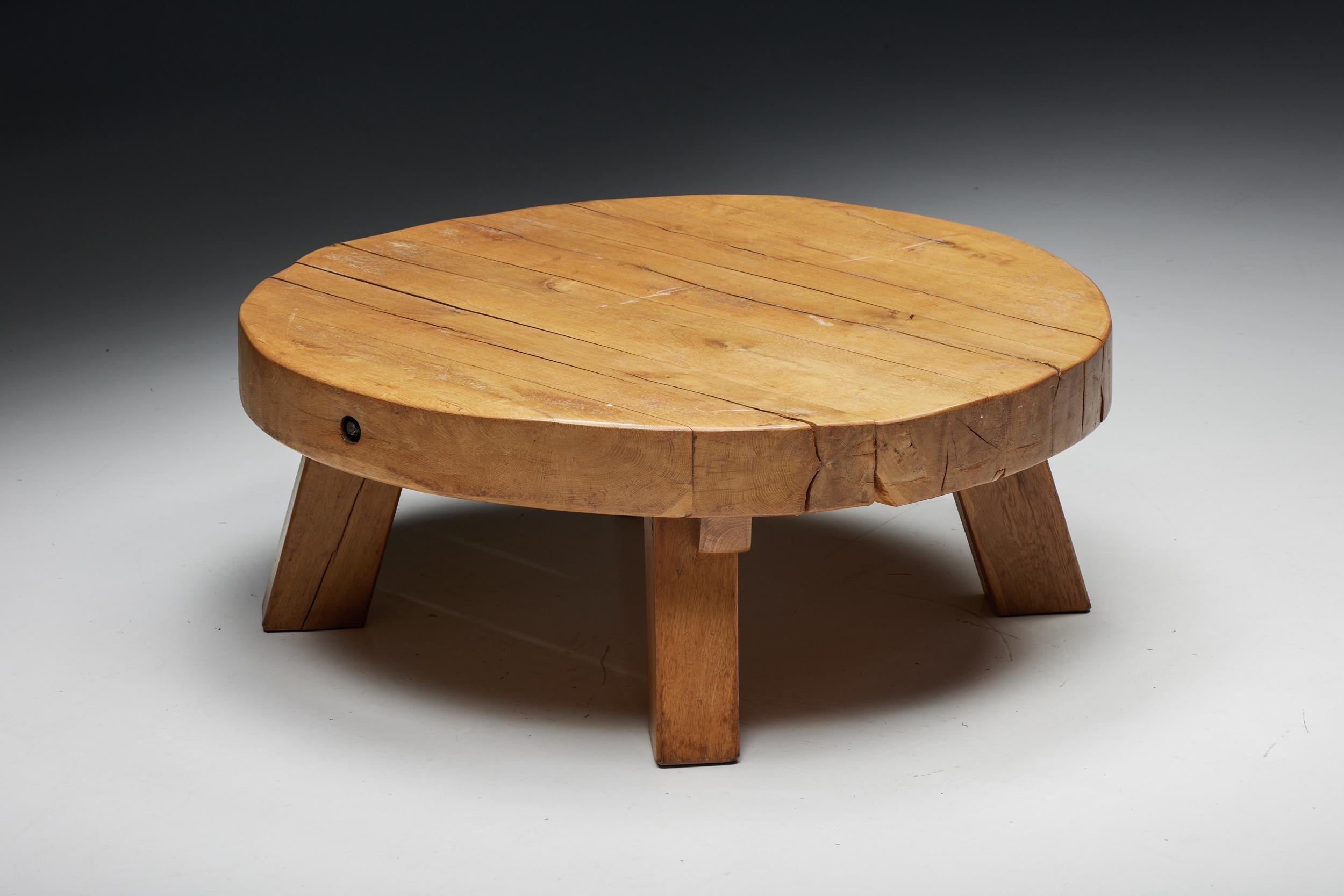 Rustic; Round; Rural; Robust; Wabi-Sabi; Wooden; Coffee table; France; 1950s;

This rustic round coffee table with a four-legged base is made of wood with a very charismatic patina. The rounded surface provides space for objects like books,