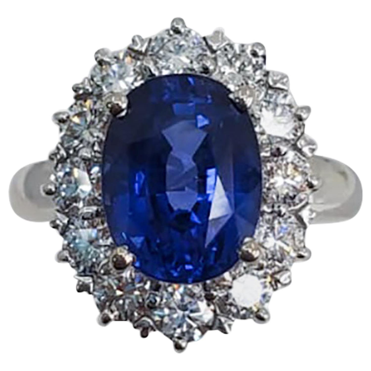 Round Sapphire and Diamond Ring with 18 Karat White Gold