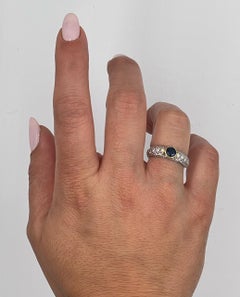 Round Sapphire Bezel Set in Yellow Gold with Pavé Set Diamonds in 18K White Gold