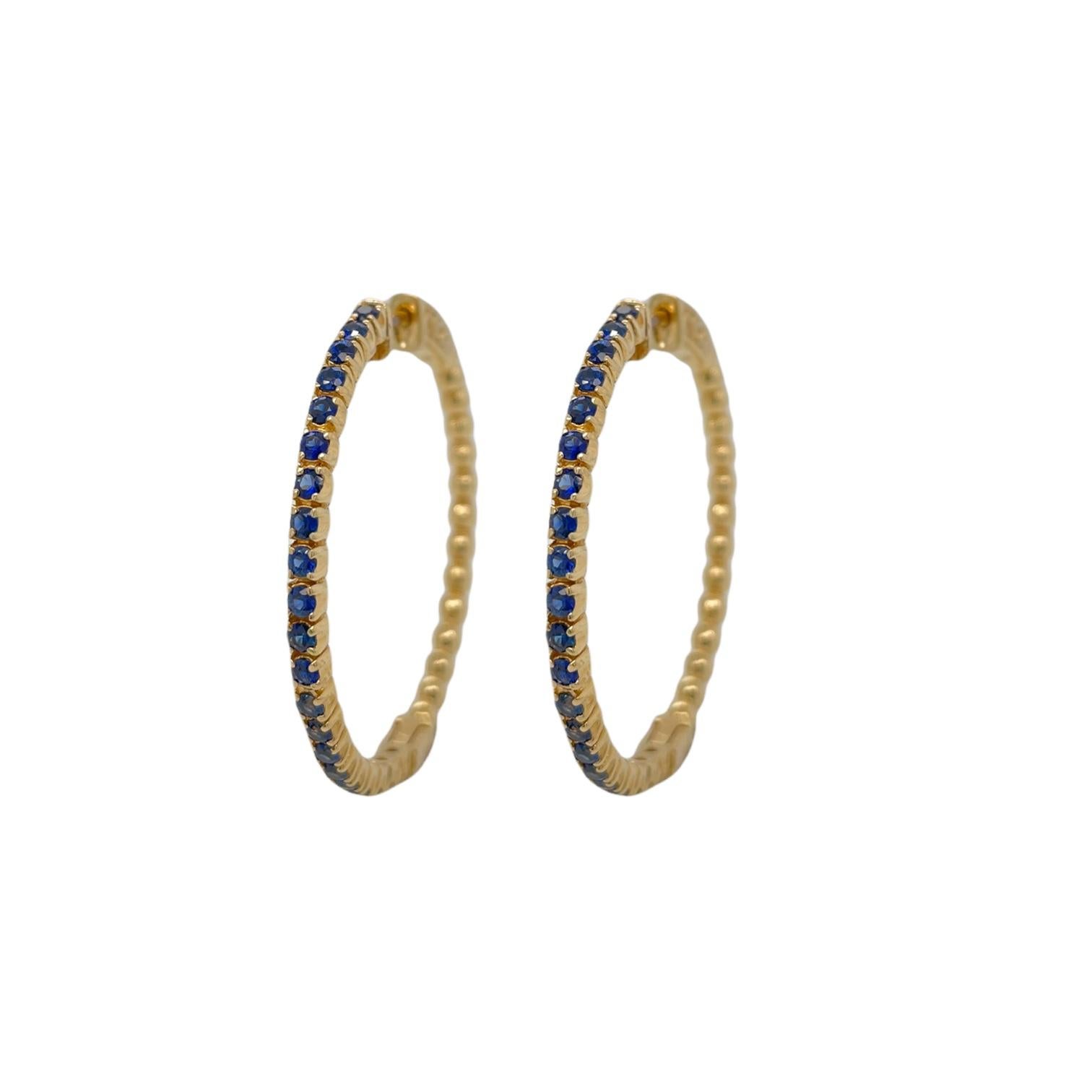 Earrings contain 42 round brilliant sapphires, 1.00tcw. Stones are mounted within handmade prong settings. Earrings measure approximately 1.5