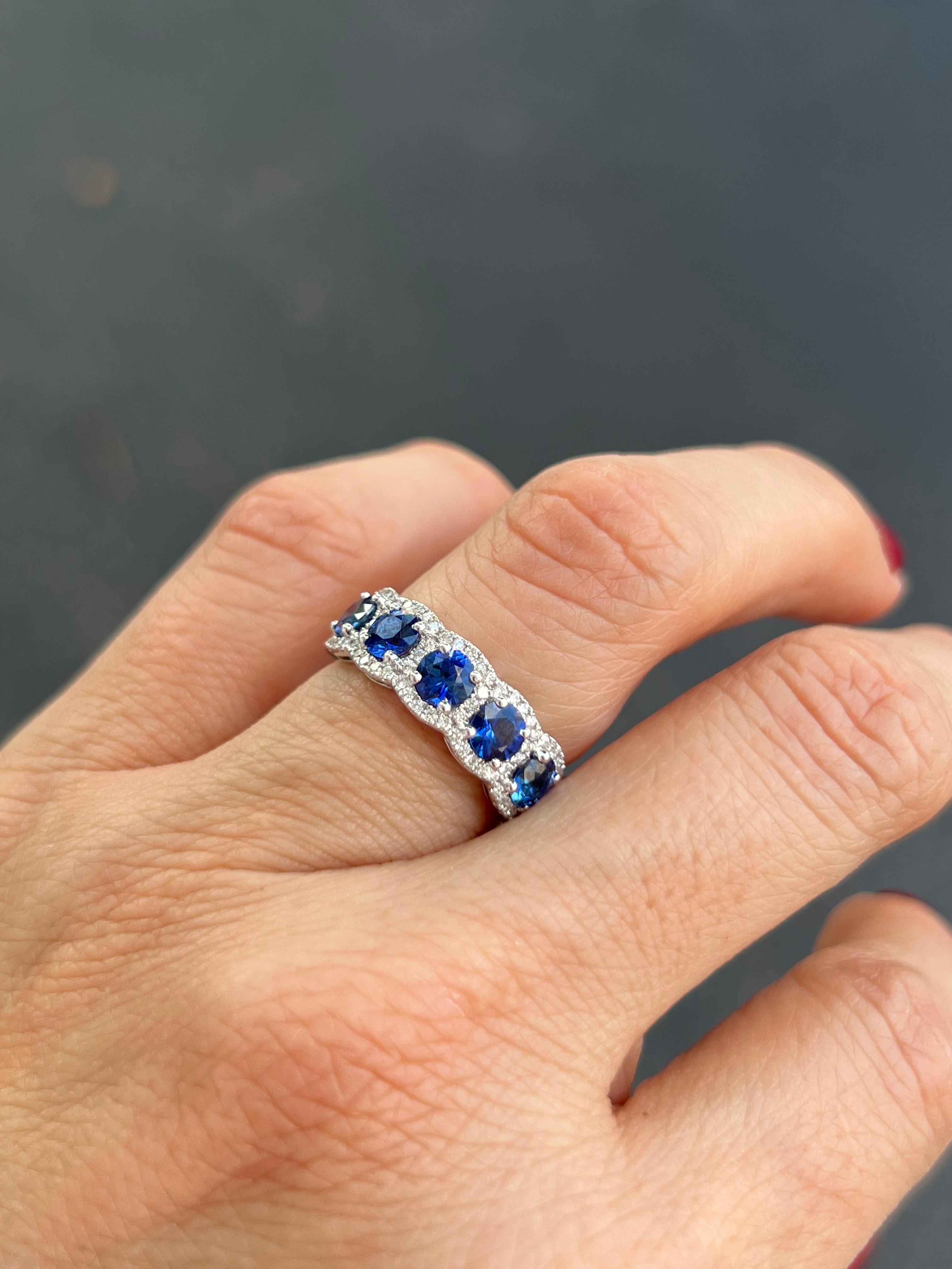 18K white gold sapphire and diamond band.

Features
18K white gold
1.85 carat total weight in sapphire
.32 carat total weigh in diamonds
The finished ring width is 6.5 mm at the top and tapers to 3mm a the sizing bar. 
Ring size 6, can be sized.