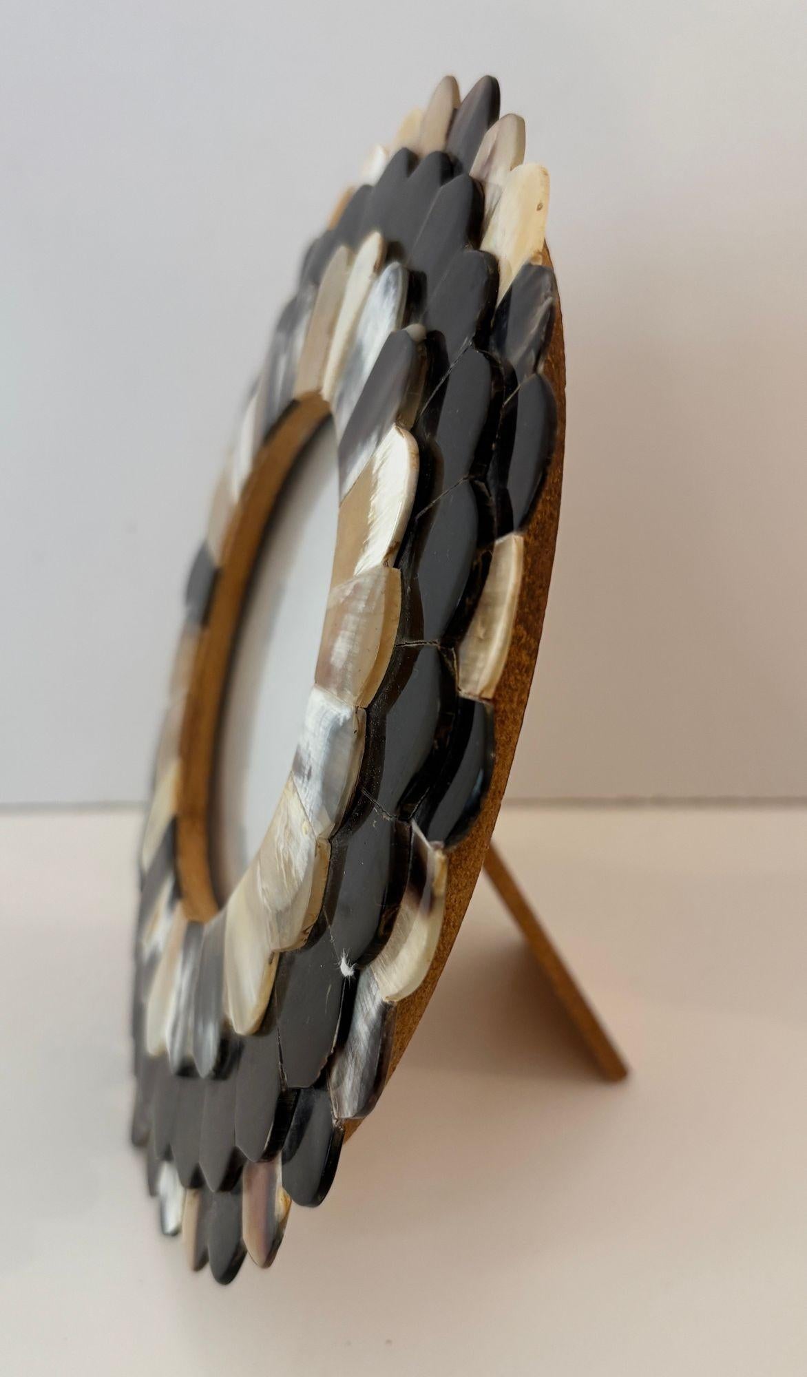 Handcrafted round picture frame with scalloped white and brown buffalo horn bone inlaid.
Vintage round inlaid bone picture in Moorish Islamic style frame.
The frame is created from 3 layers of hand-carved horn in white, brown, black textured organic