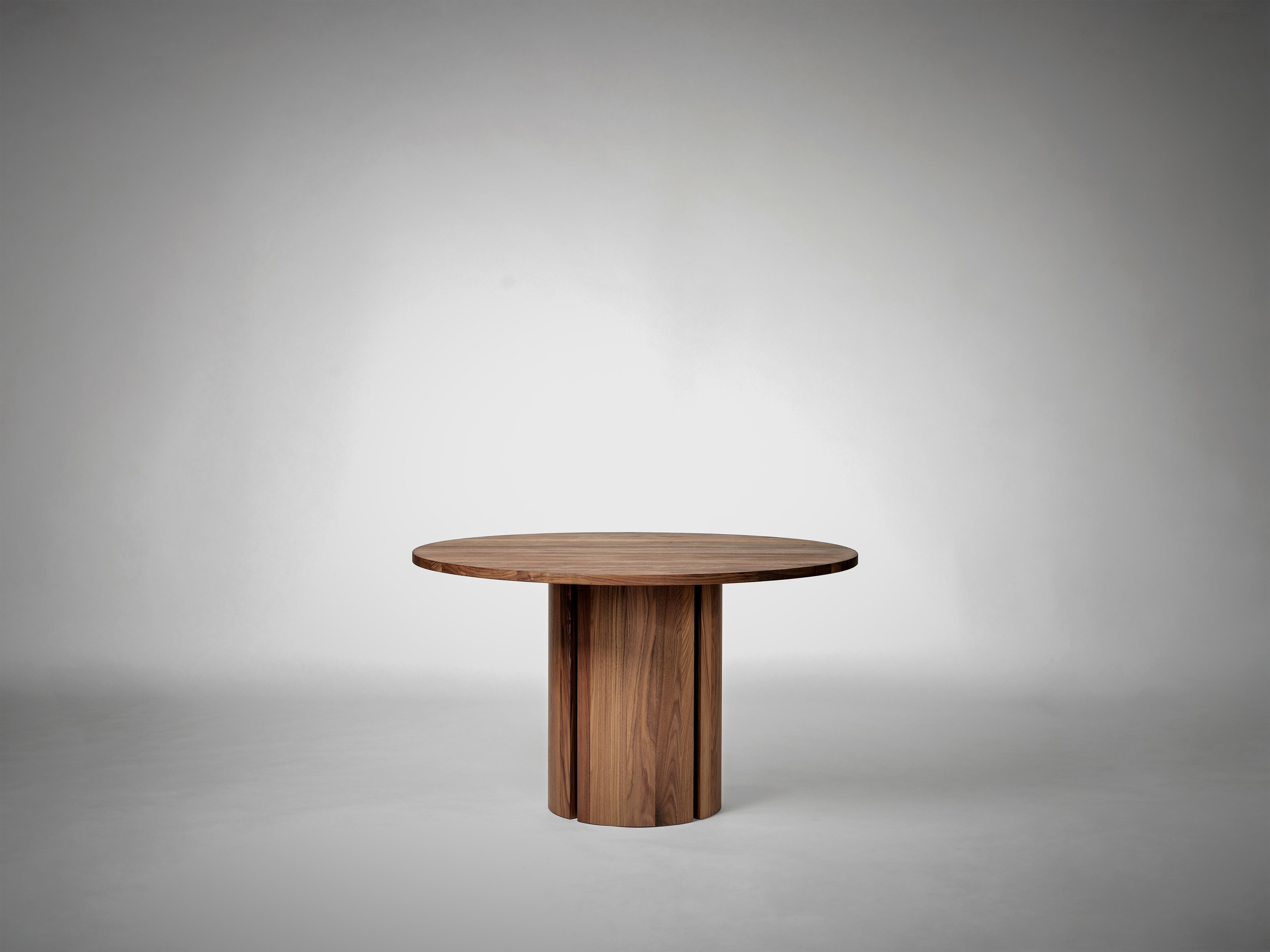 Inspired by light breaking through narrow voids in architectural structures, Aperta features a precise slit, creating a sense of lightness to its solid form. 

The Aperta Round Table has manually adaptable legs, allowing for 2 distinct