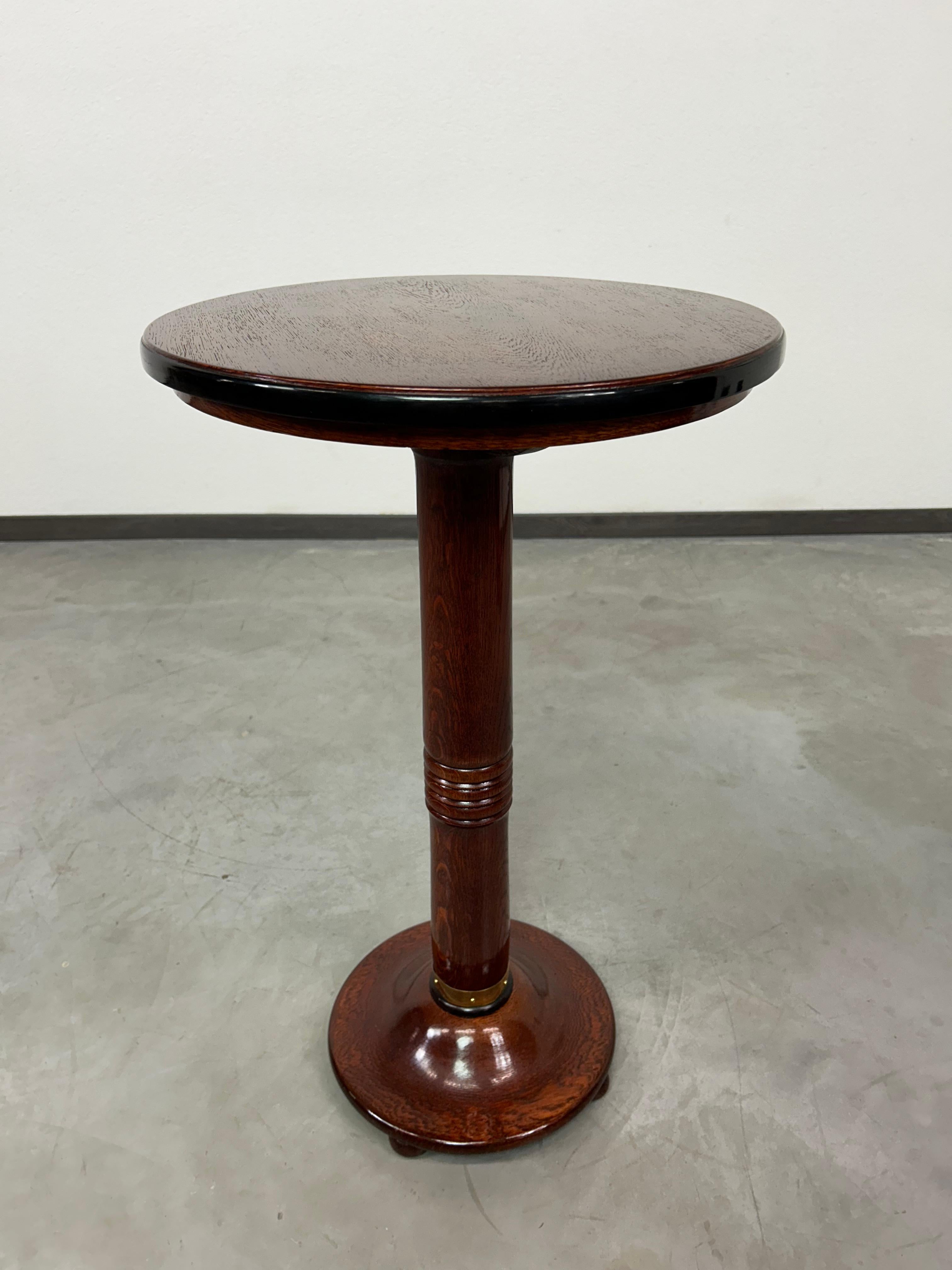 Round secession side table. Professionally stained and repolished.