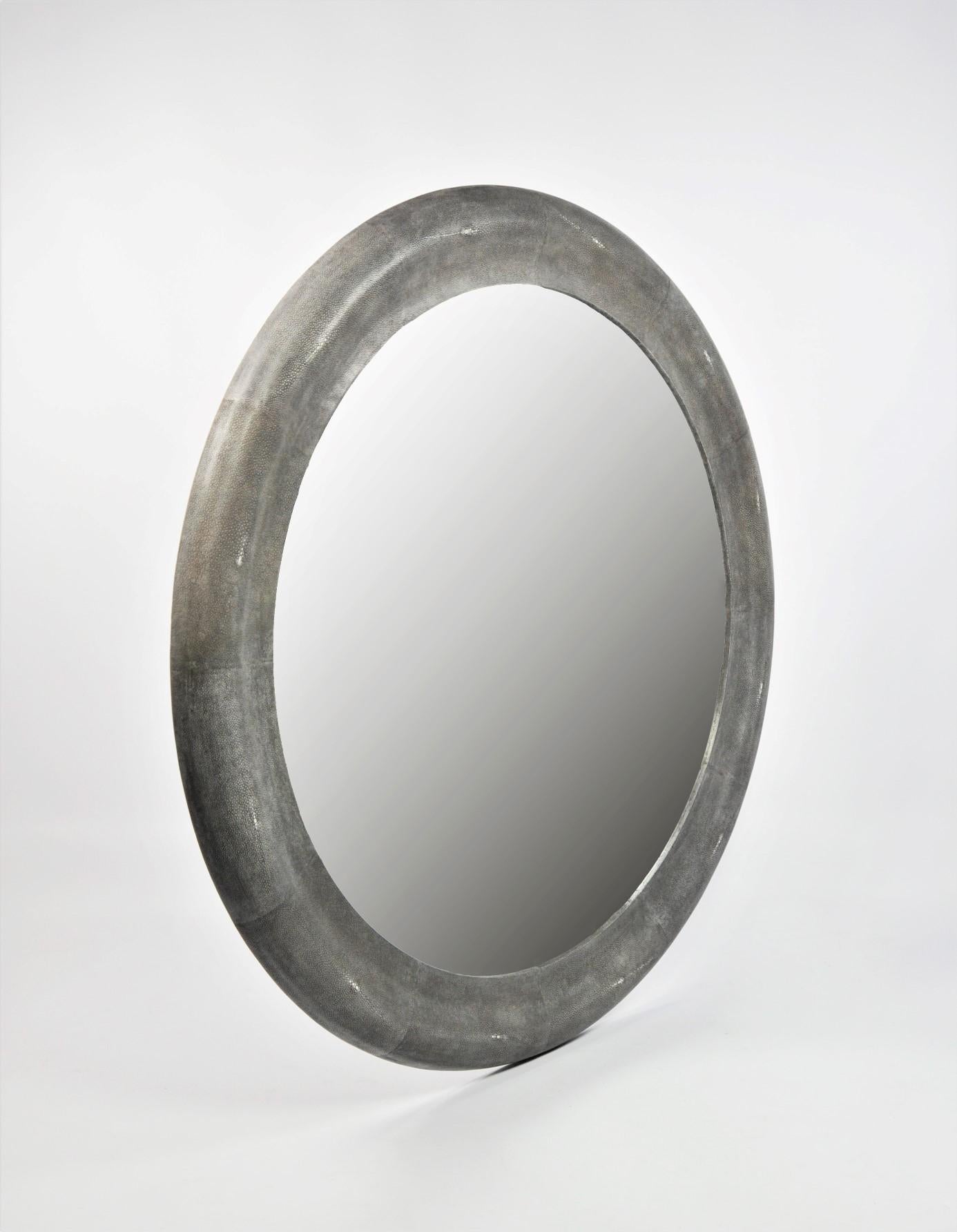 This circular mirror is made of shagreen in a dark grey colour (Our ref CARBON).
A timeless design for this large piece which can be made in custom dimensions.
 
The diameter of this mirror is 47,2