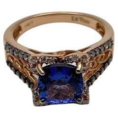 Anillo de oro rosa de 14 quilates con diamante blanco y tanzanita violeta azul de corte redondo