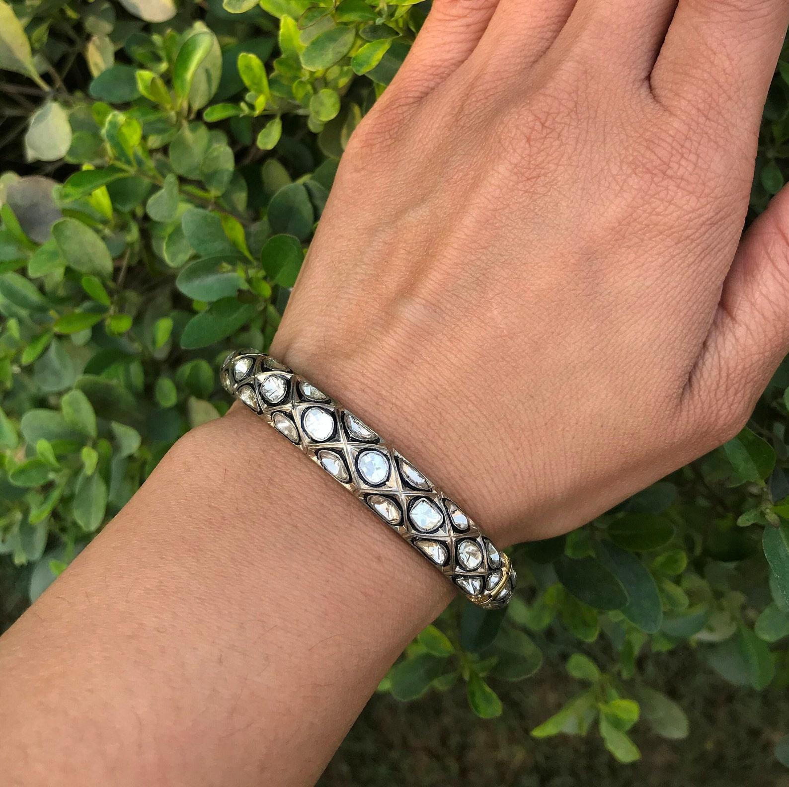 Round Shape Rosecut Diamond Bangle 925 Sterling Silver Antique Jewellery For Her.

Materials: Silver
Gemstone: Diamond
Bracelet width: 10 Millimetres
Bracelet length: 2.36 Inches

Diamond Weight: 6.90 cts

Dimension :
Inner Diameter: