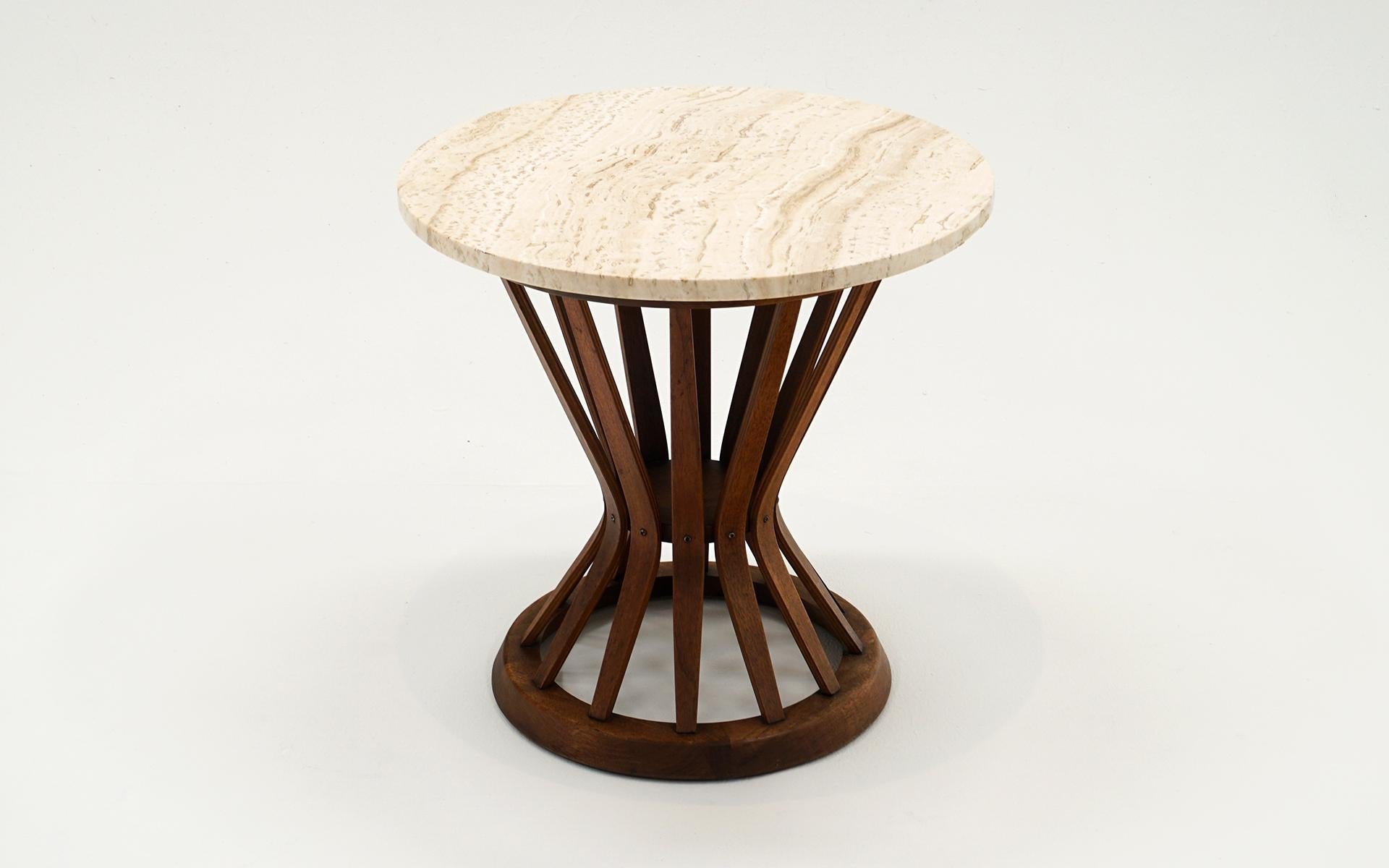 Sheaf of Wheat side table, walnut frame with original Italian travertine top designed by Edward Wormley for Dunbar, 1950s.   Beautiful veining in the travertine with no chips, repairs or stains.  Some slight irregularities along the edges which is