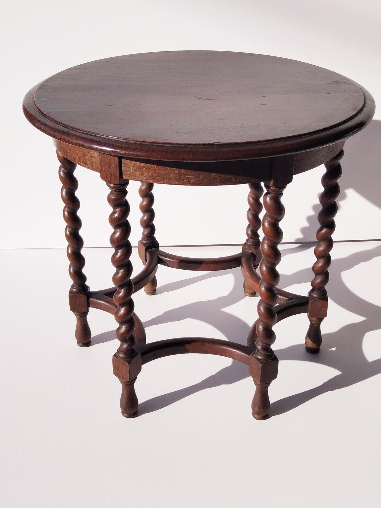 Round antique table of the 19th century. Wood with bobbin legs

This table is raised on a base composed of six bobbin legs and a octagonal star stretcher, also turned.
 
  

 
   