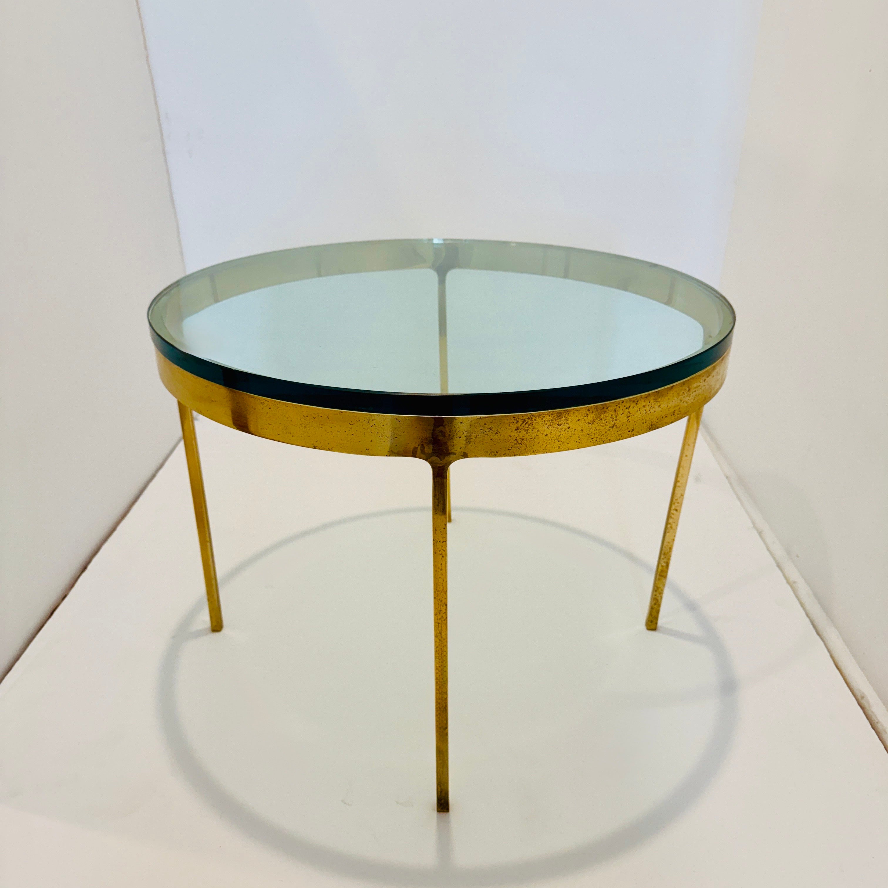 Mid-Century Modern side table with brass base featuring stylized leg design with a thick tempered glass top.  Original design dates back to the 1960's, with Zographos Designs relaunching the timeless designs in the 1980's and 90's. The stainless