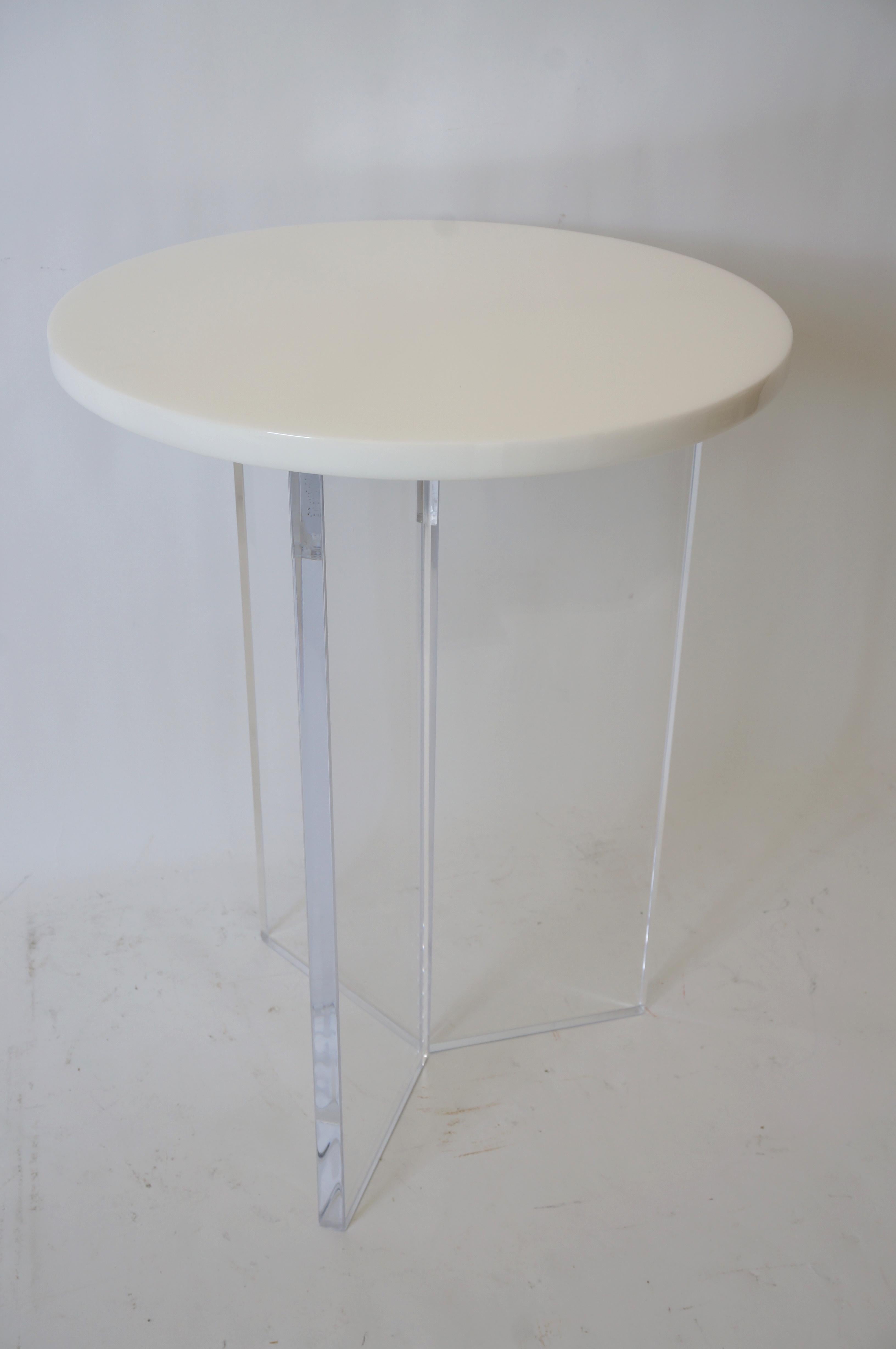 This stylish, chic and cleaned lined lucite table can be used as an end or side table.