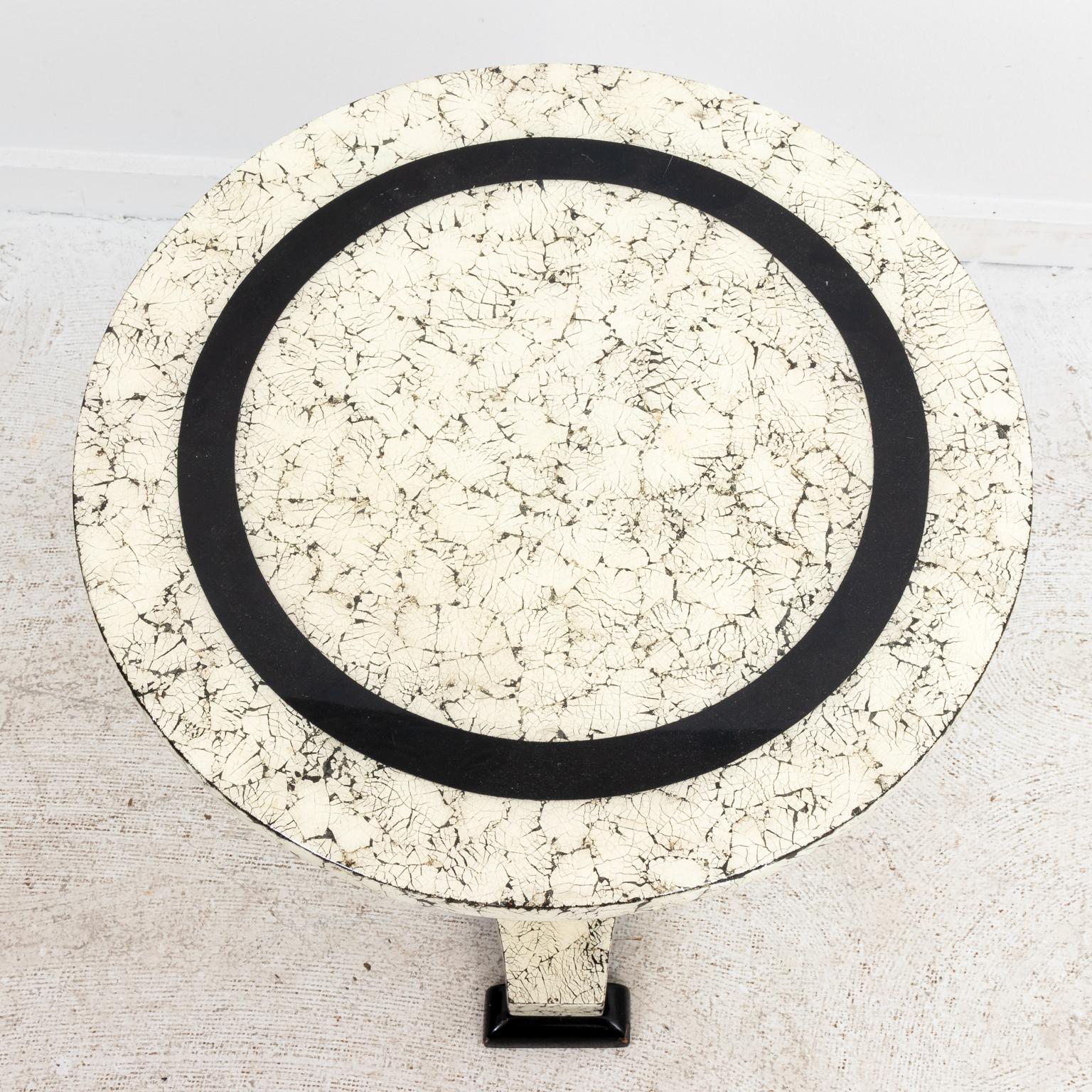 Painted round side table with faux crackled finish on a pedestal base. Please note of wear consistent with age including chips and minor finish loss.