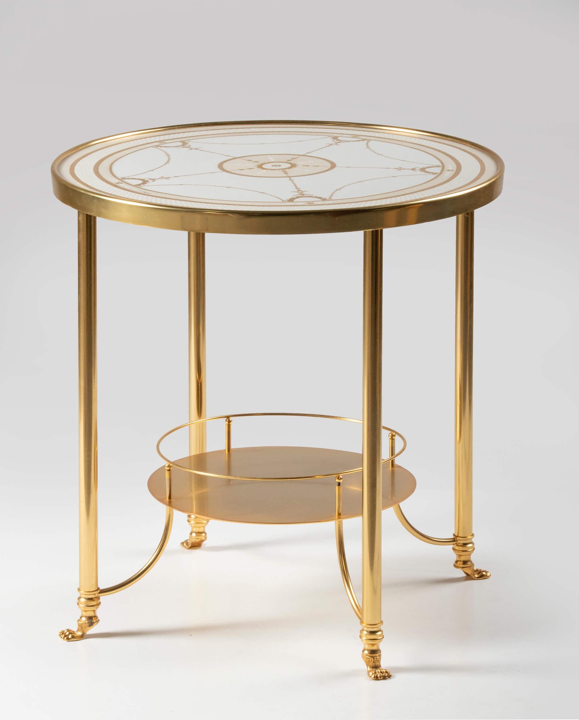 Beautiful round table from the Italian brand Giulia Mangani. The table is made of gold-colored brass, the top is made of porcelain, with a beautiful hand painted decoration. The table is elegant and chic, with beautiful, refined details.
The table