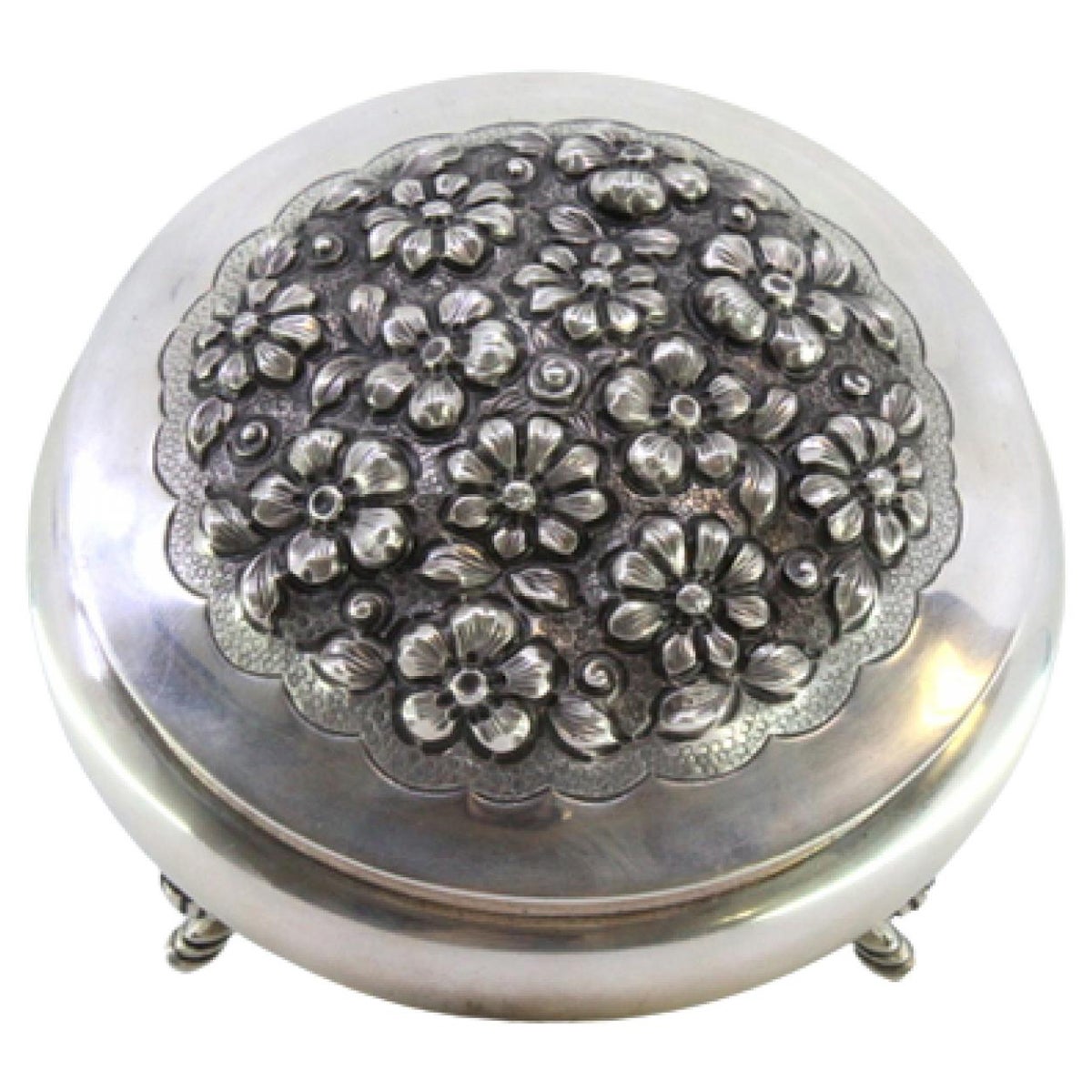Round silver candy box w/ floral reliefs
4 feet