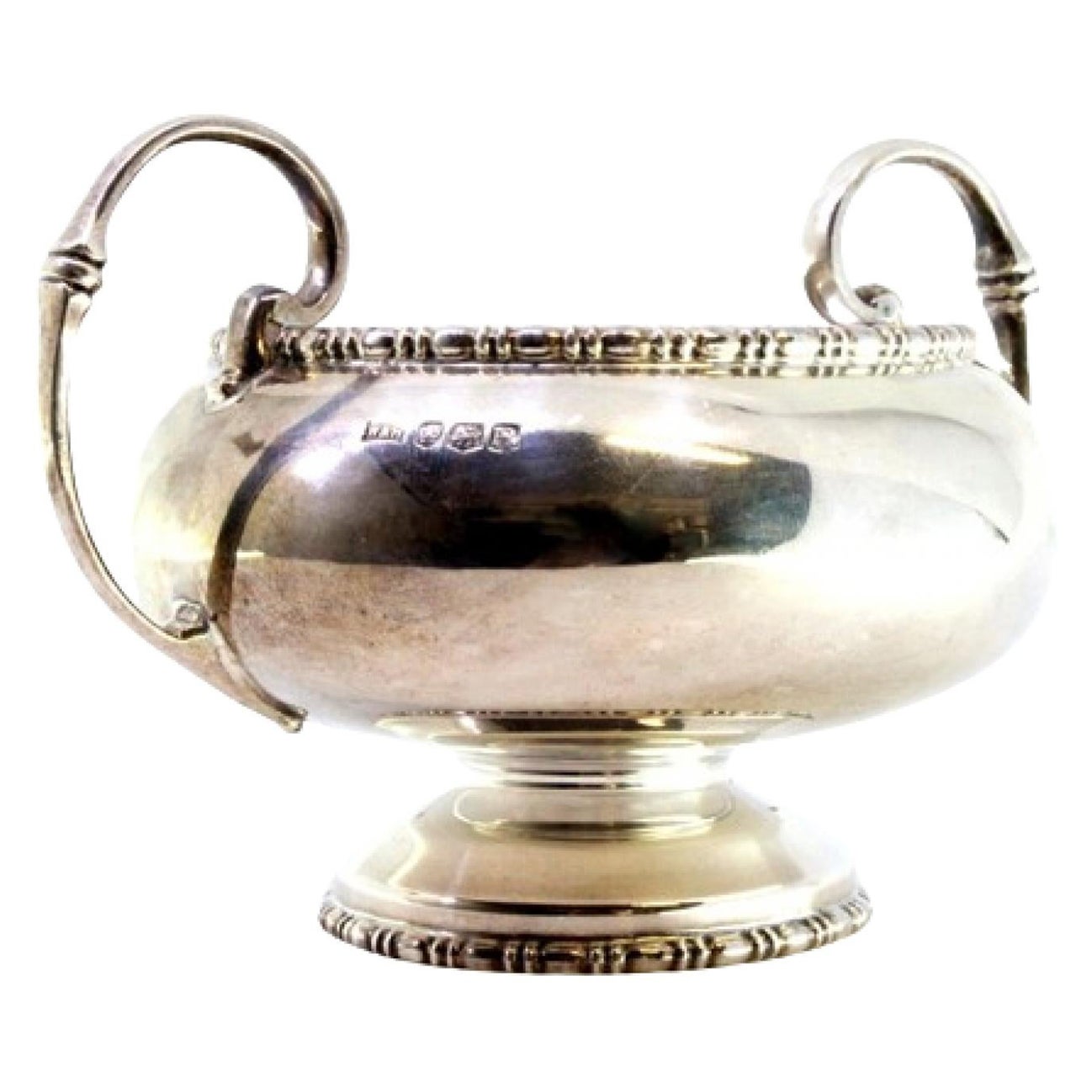 Round silver candy box w/ top reliefs, 2 applied handles & round base