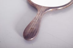 Round Silver Hand Mirror With a Refined Design