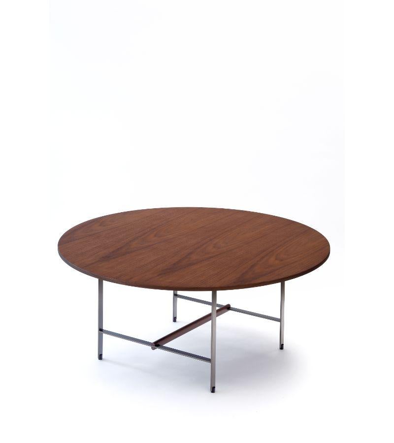 Round sisters console by Patricia Urquiola
Materials: Bronze lacquered structure with the solid walnut cross member. Walnut veneer top.
Technique: Lacquered metal. 
Dimensions: D 90 x H 40 cm
Available in different shapes. 


COEDITION is a
