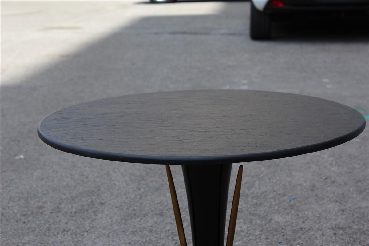 Round slate coffee table in brass mahogany Italian design 1950s midcentury.
It is very reminiscent of the style of Paolo Buffa famous Italian designer.