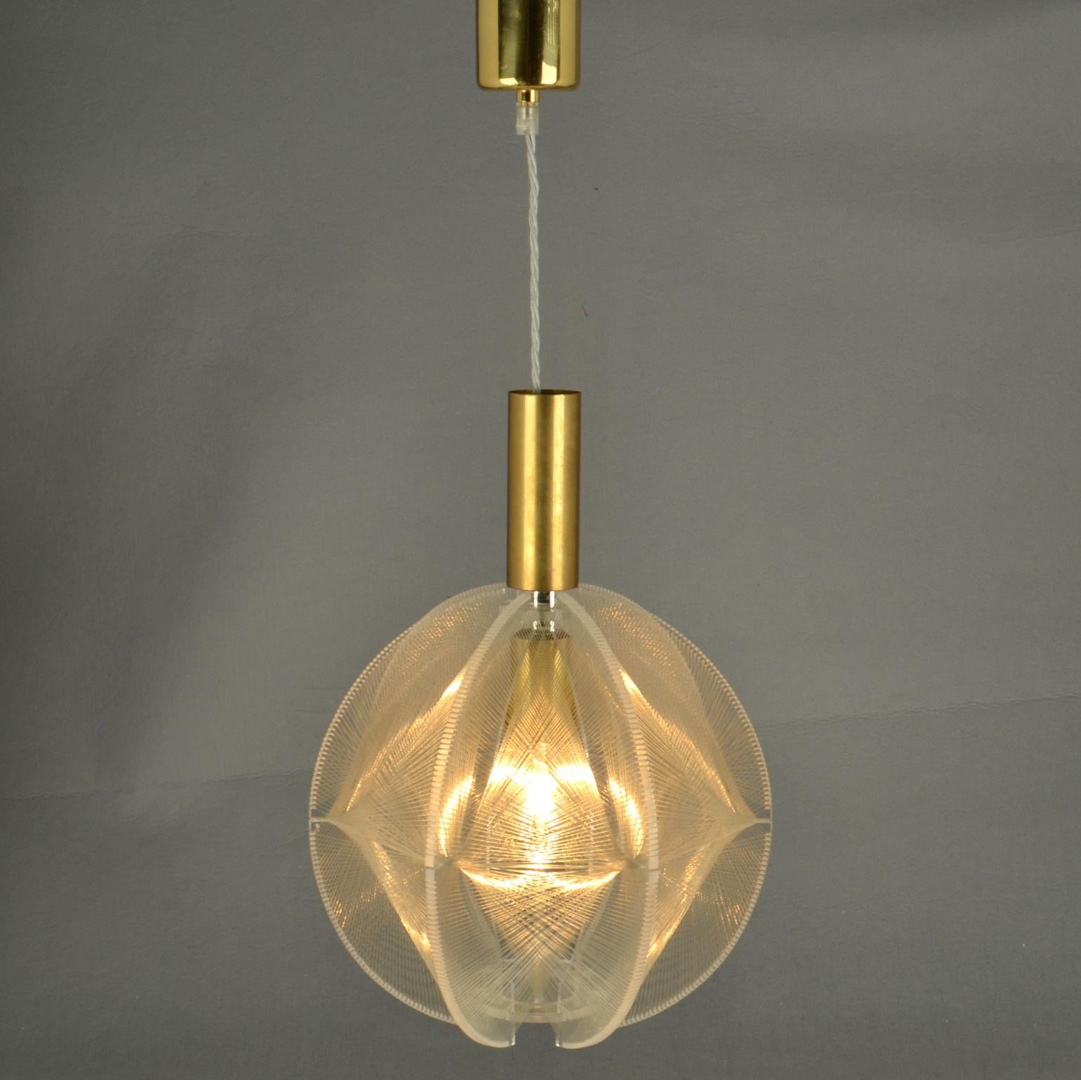 Sculptural round small  lamp in clear acrylic / Perspex and clear transparent wire accompanied brass internal fittings holder. The design is influenced by the pioneer, Avant Garde artist and sculptor Naum Gabo (1890–1977). 
These lamps are