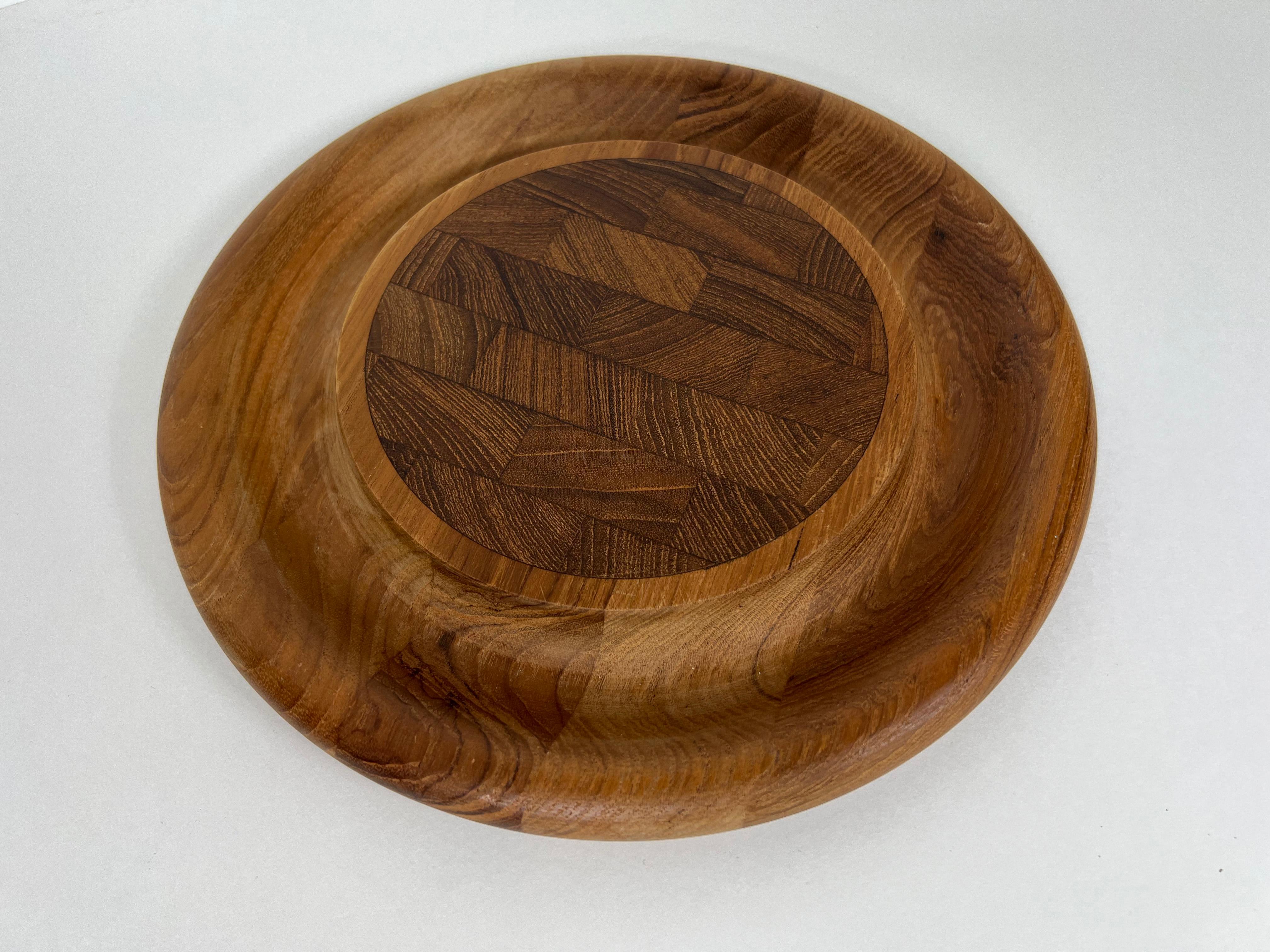 Vintage round cutting board in end-grain teak by Jens Quistgaard for Dansk. Great for use a charcuterie or serving board. Marked 