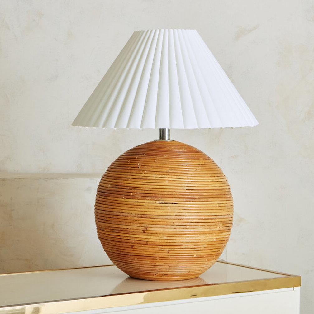 A round split reed table lamp featuring a gorgeous circular pattern similar to designs by Gabrielle Crespi. Lampshade is not included. Sourced in Spain.
