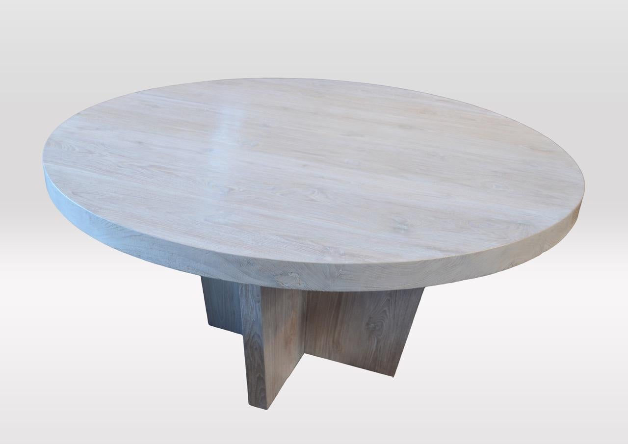 Reclaimed teak dining table with a light white wash finish. Shown on a modern cross base.

The St. Barts Collection features an exciting new line of organic white wash, bleached and natural weathered teak furniture. The reclaimed teak is bleached