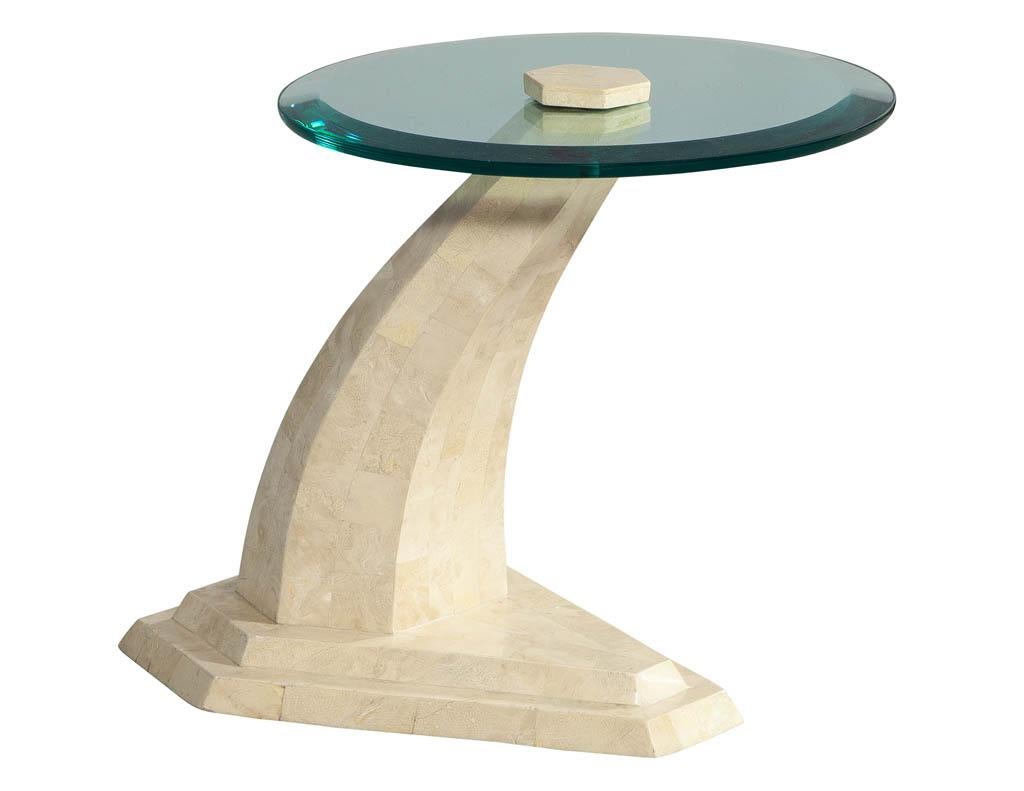 Round stone and glass side table. Featuring uniquely designed stone pedestal with thick round glass top.

Price includes complimentary curb side delivery to the continental USA.