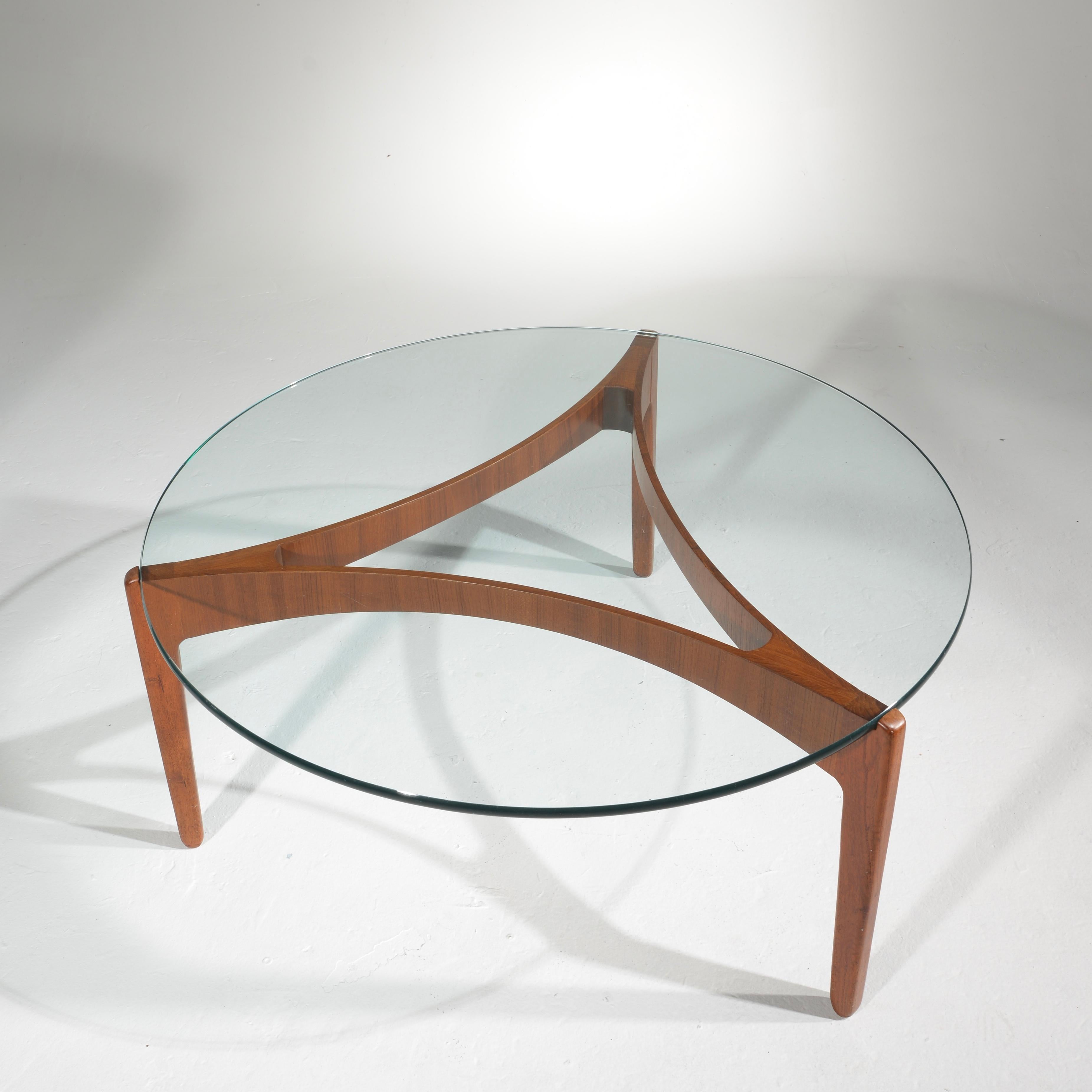 Glass top table on a teak base by Svend Ellekjaer.
 