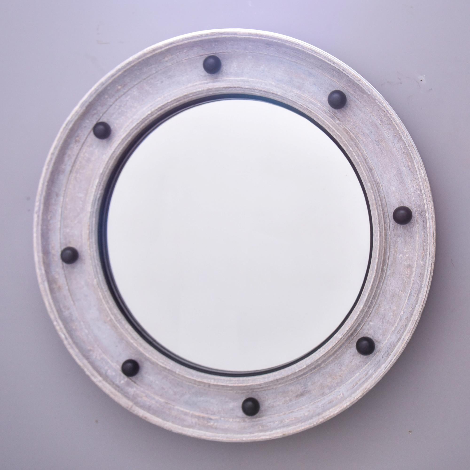 New and custom made for us in England. This large, round, Swedish-style mirror has a wide beveled frame with a gray painted finish accented with contrasting black spheres. 

Actual mirror size: 28.75” h x 28.75” w