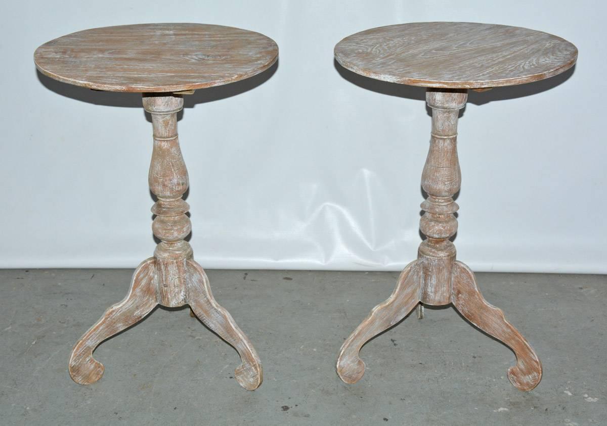 Pair of rustic white washed round Gustavian style pedestal tables with handcrafted turned base. Perfect as night table, end tables, occasional table, tea or wine table.