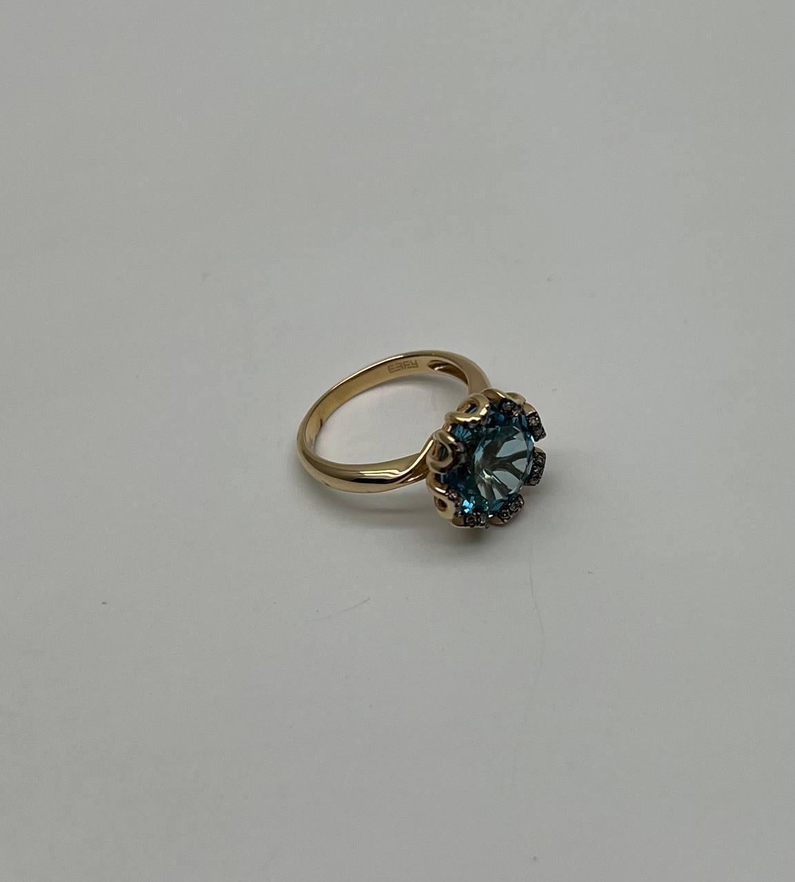 A sophisticated ring featuring a striking blue Swiss Topaz with a captivating brilliance.
The gemstone is elegantly surrounded by a series of accented diamonds, enhancing its allure and creating a stunning visual effect.
14K Yellow Gold. 0.12 CTW