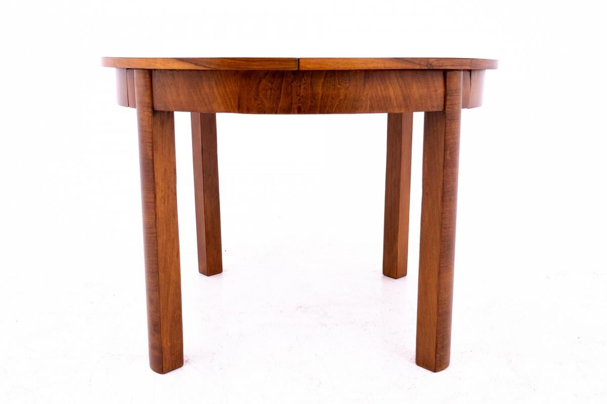 Art deco table from the 1940s, Poland.

The furniture is in very good condition, after professional renovation.

Dimensions: height 78 cm / diameter 110 cm / length 160 cm