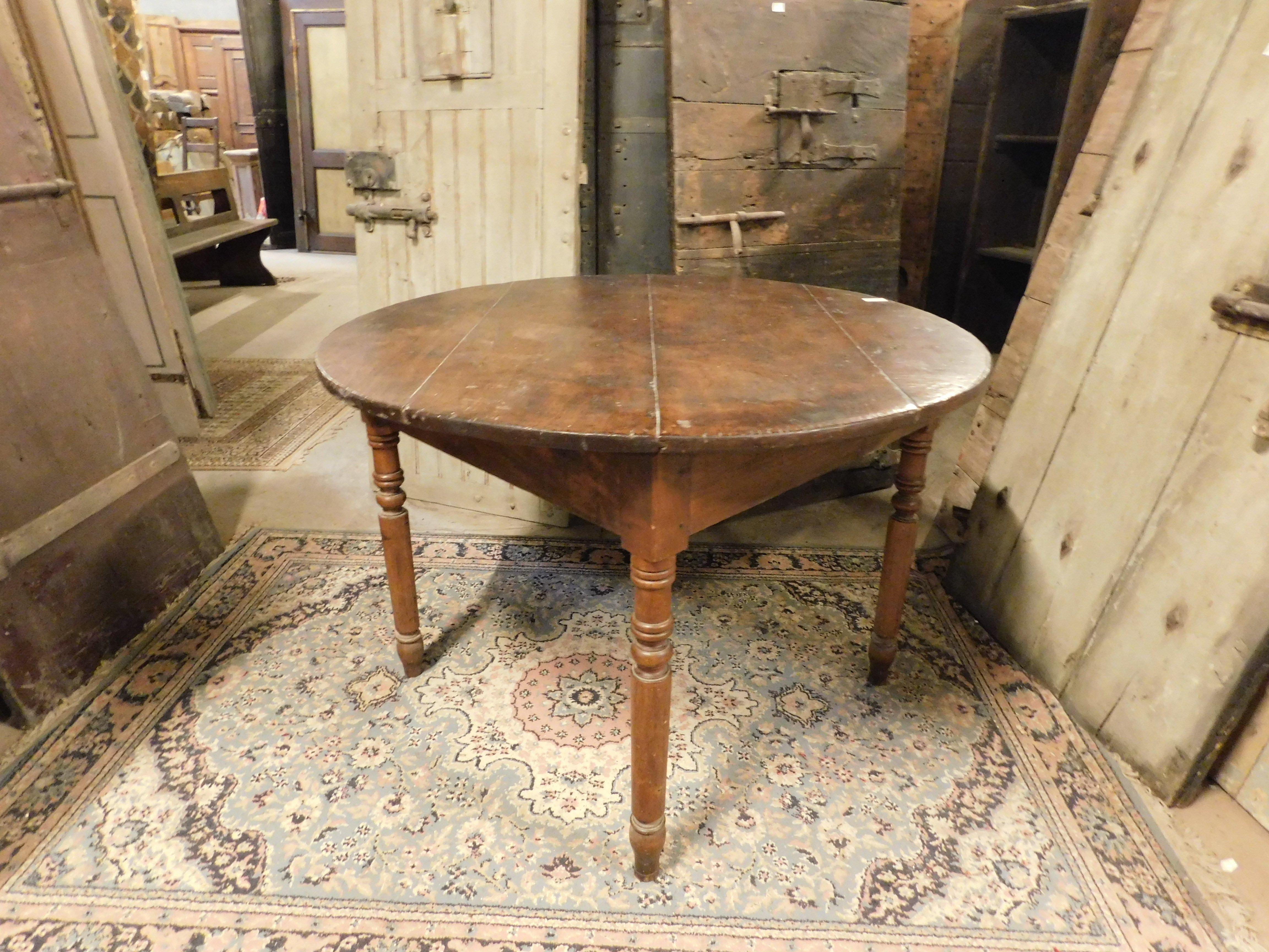 Italian Round table in walnut and beech wood, carved legs, Italy For Sale