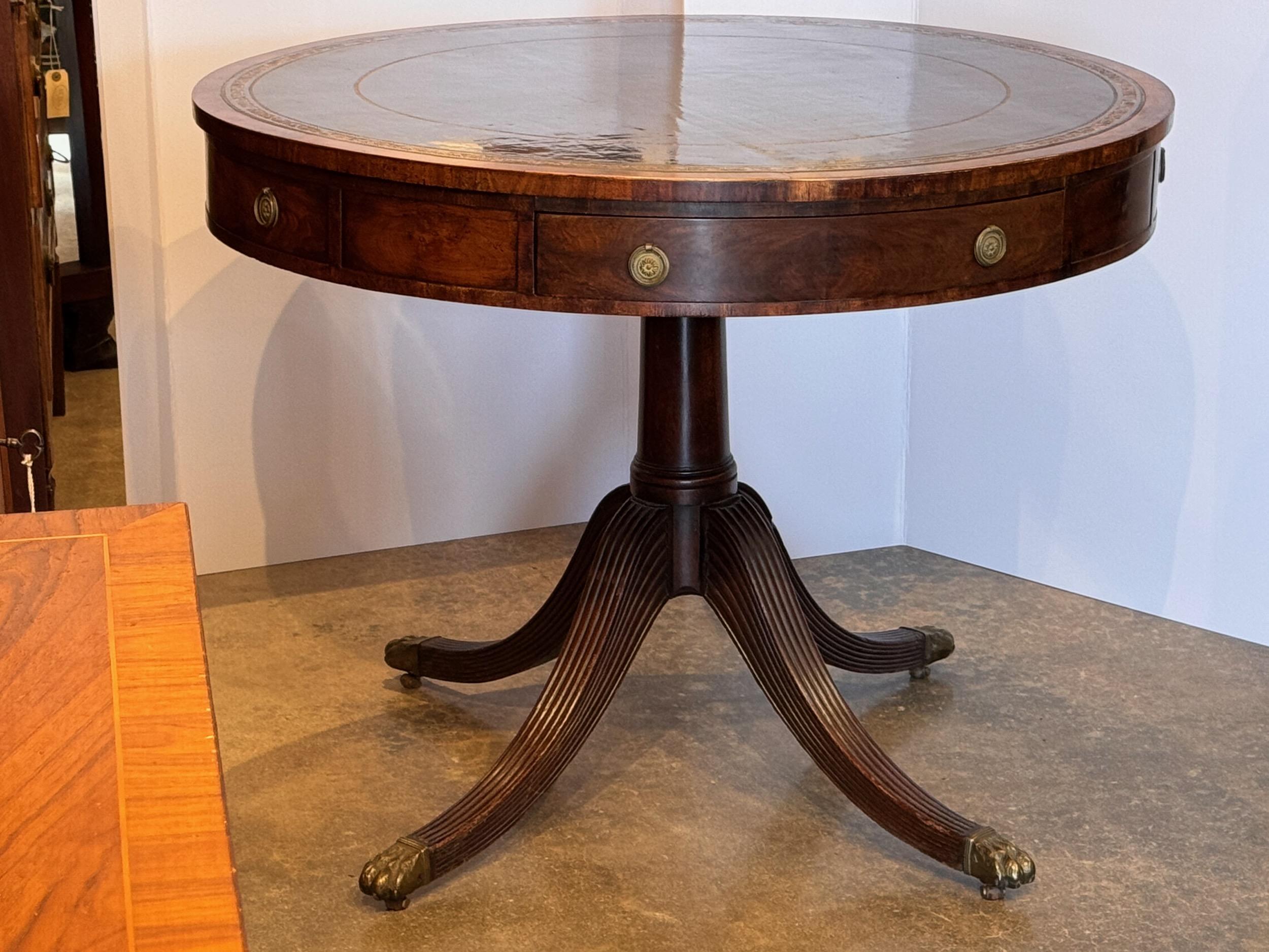 A nice English drum table . Very useful and beautiful.